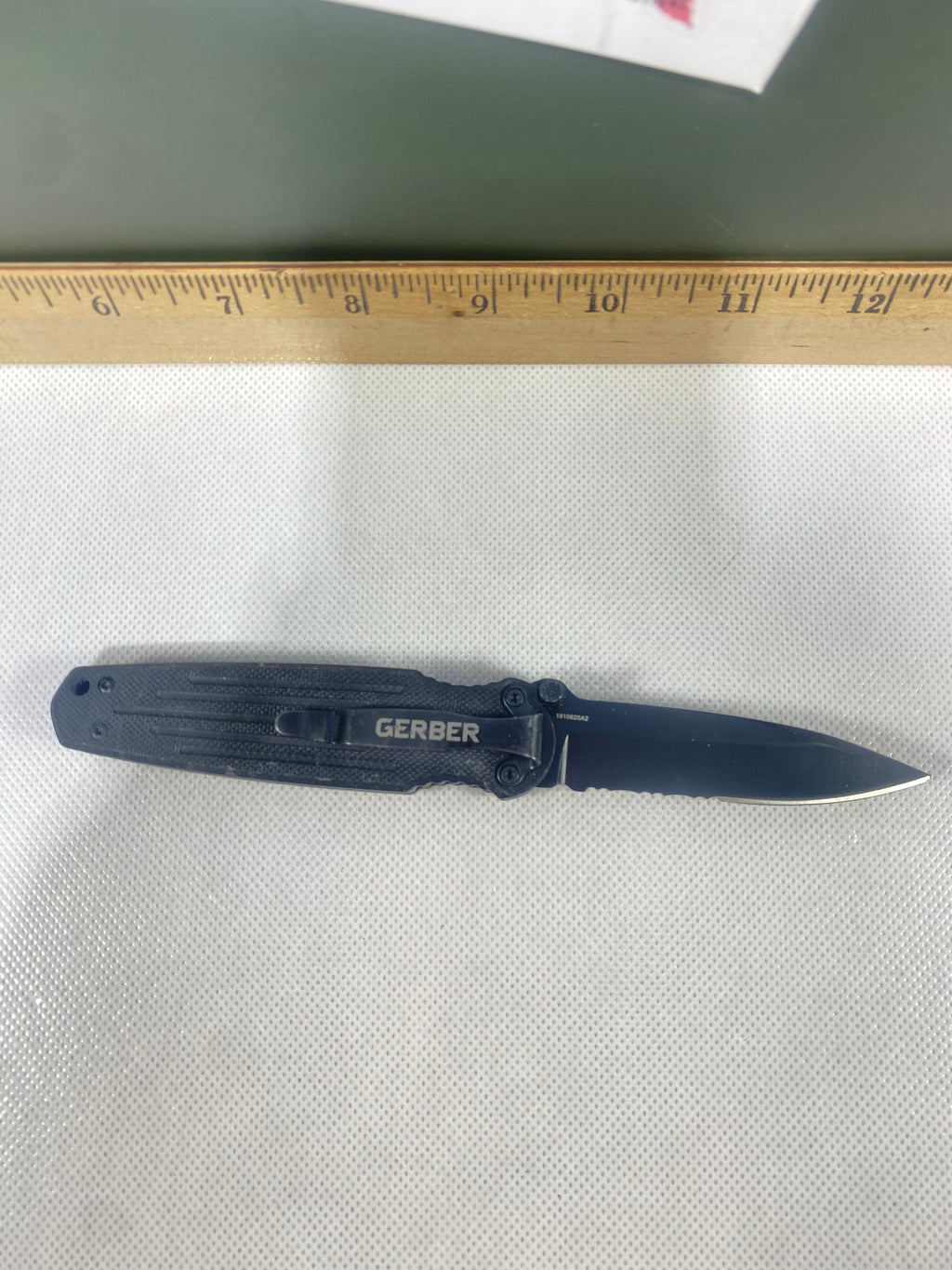 Gerber #-11. Mini Covert. Light usage. Ding on tip.