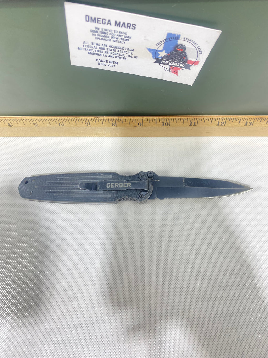 Gerber #-13. FAST Folding Covert. Light usage. Broken Tip. Resharpened.