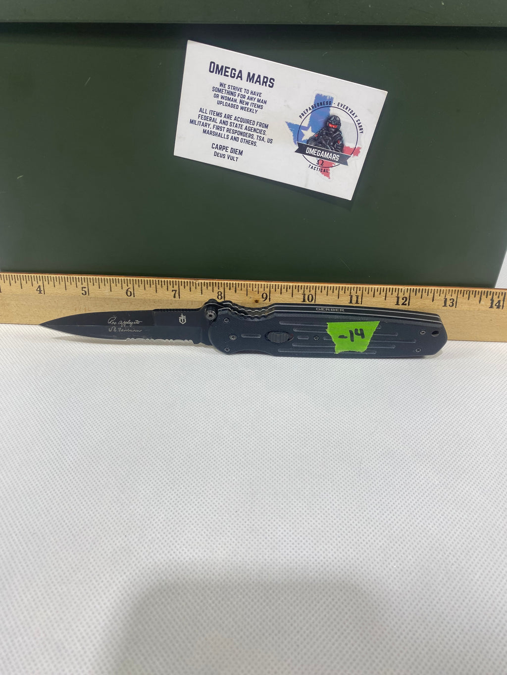 Gerber #-14. FAST Folding Covert. Light usage. Blade a little loose. Pocket clip missing a screw. Dings on the blade.