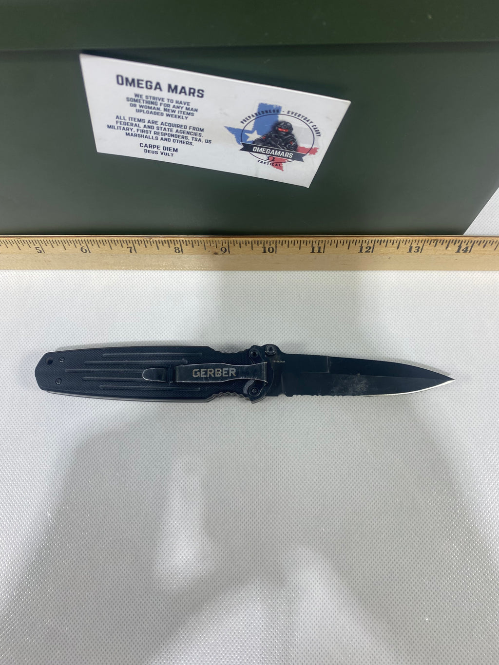 Gerber #-14. FAST Folding Covert. Light usage. Blade a little loose. Pocket clip missing a screw. Dings on the blade.