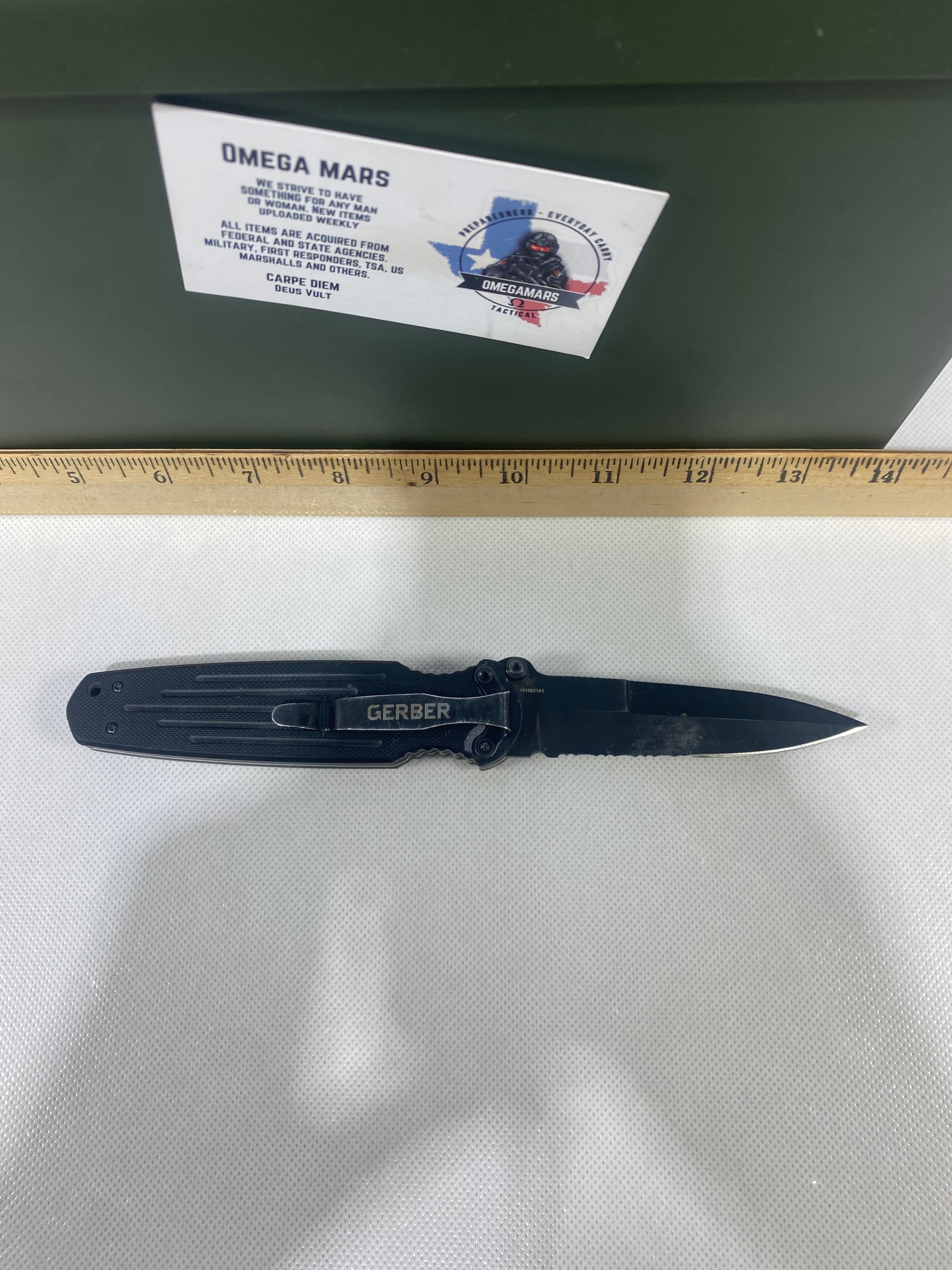 Gerber #-14. FAST Folding Covert. Light usage. Blade a little loose. Pocket clip missing a screw. Dings on the blade.