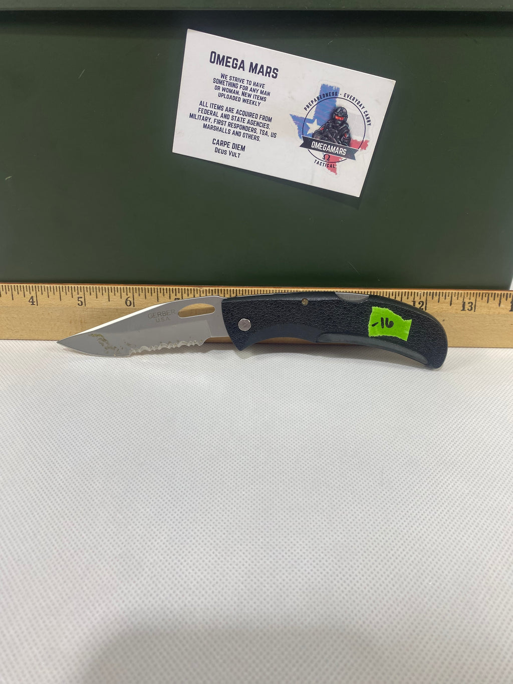 Gerber #-16. EZ Out. Light usage. Dirty. Ding on the blade.