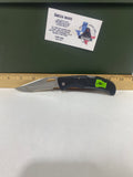 Gerber #-16. EZ Out. Light usage. Dirty. Ding on the blade.