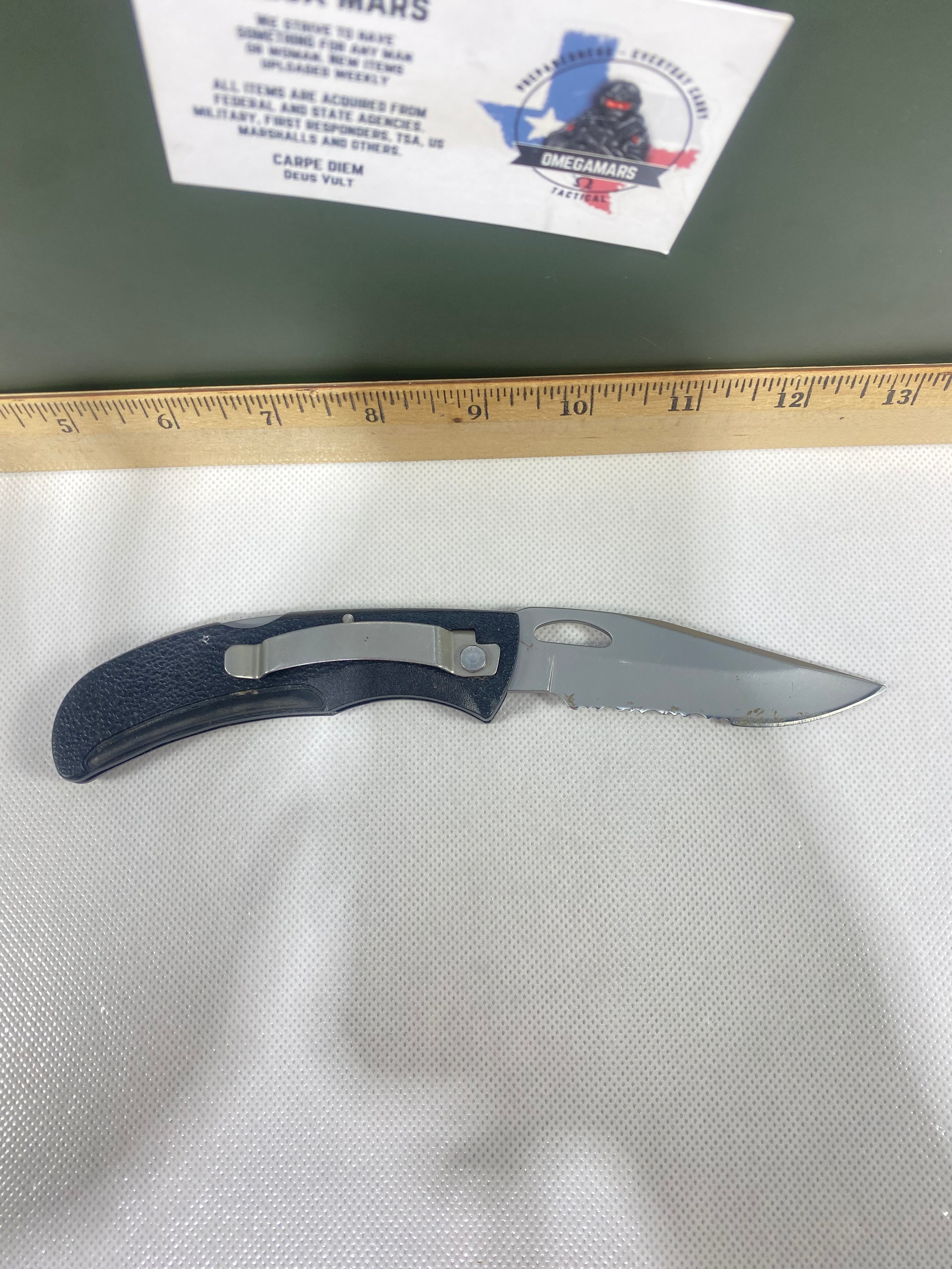 Gerber #-16. EZ Out. Light usage. Dirty. Ding on the blade.