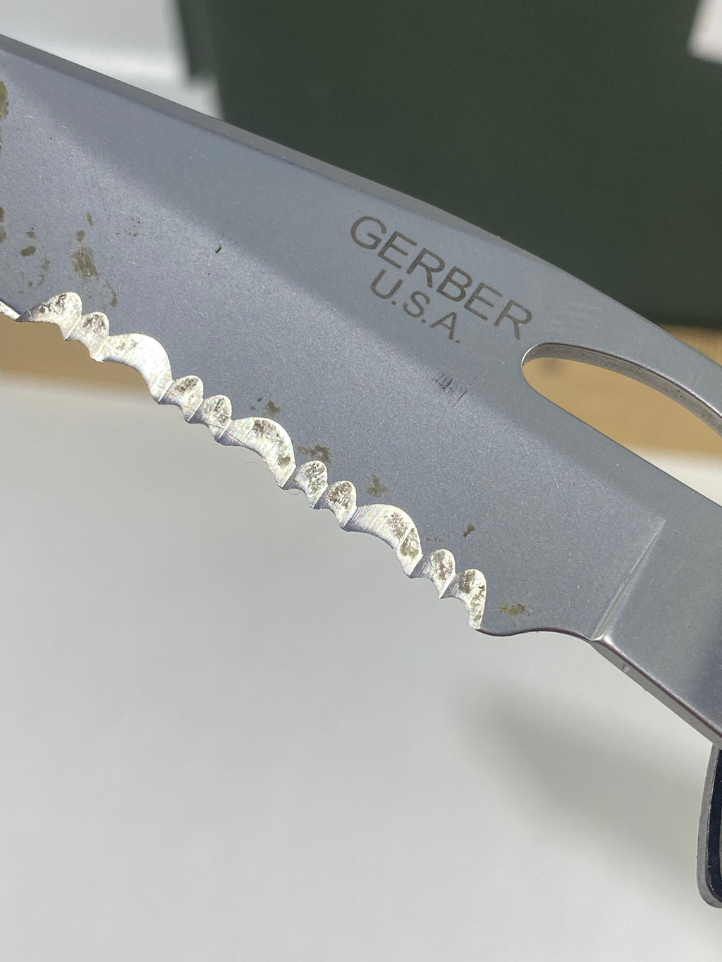 Gerber #-16. EZ Out. Light usage. Dirty. Ding on the blade.