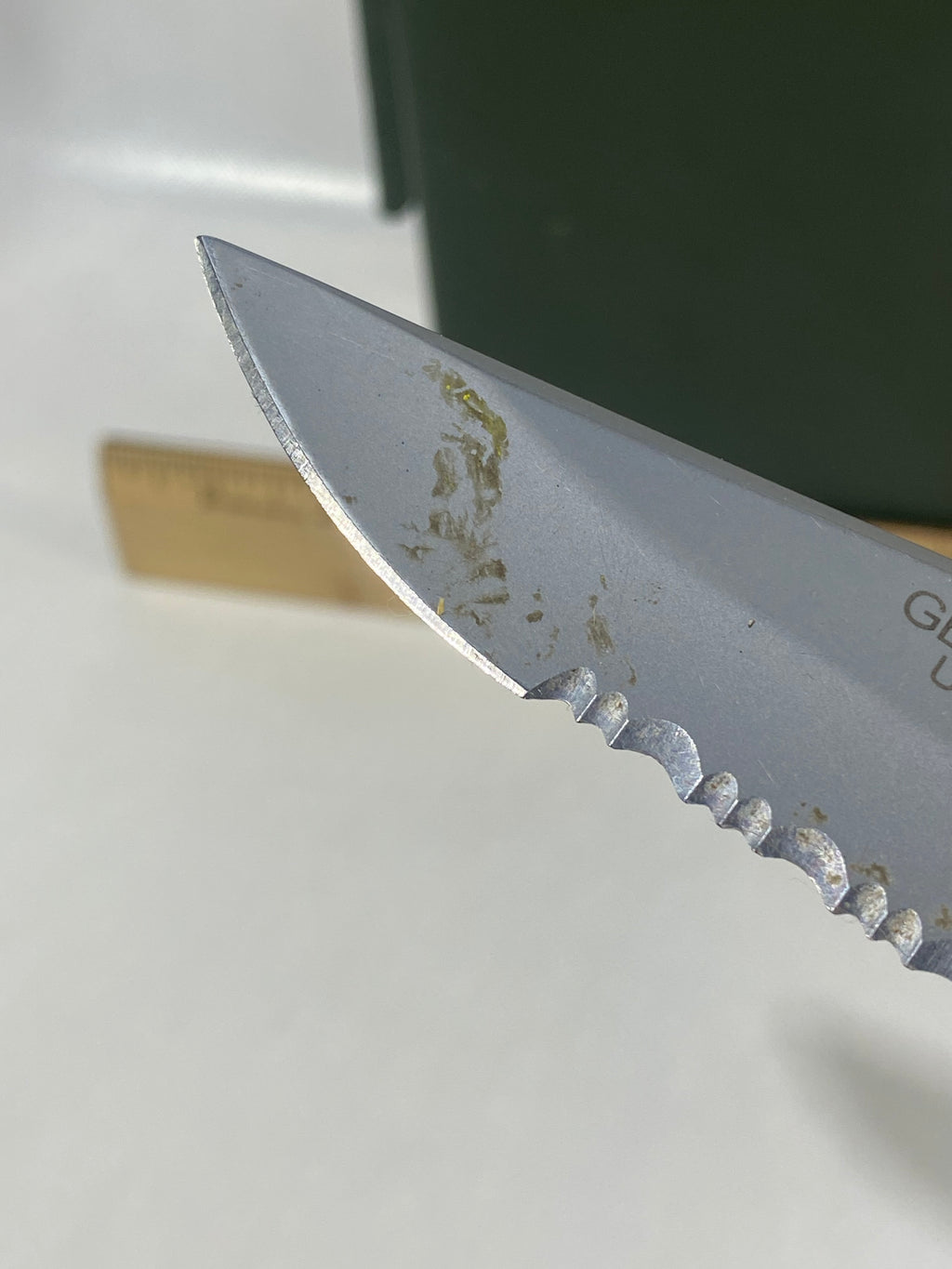 Gerber #-16. EZ Out. Light usage. Dirty. Ding on the blade.
