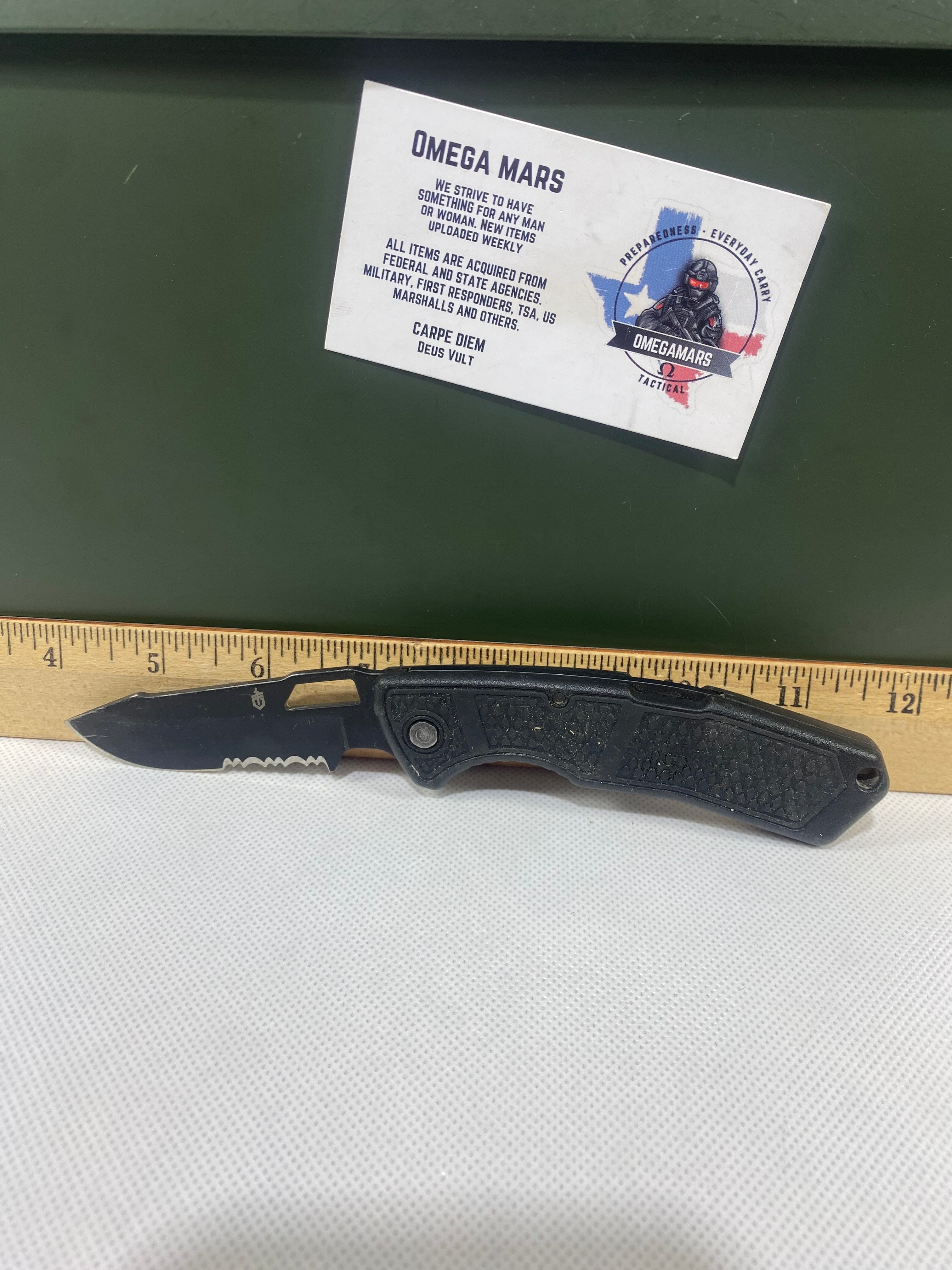 Gerber #-34. Order. Light usage. Resharpened. Dirty. Ding on blade.
