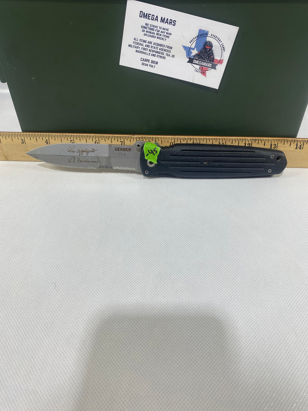 Gerber #-45. Applegate-Fairbairn Combat Folder. Light usage. Dirty. Blade has someone's name scratched on it.
