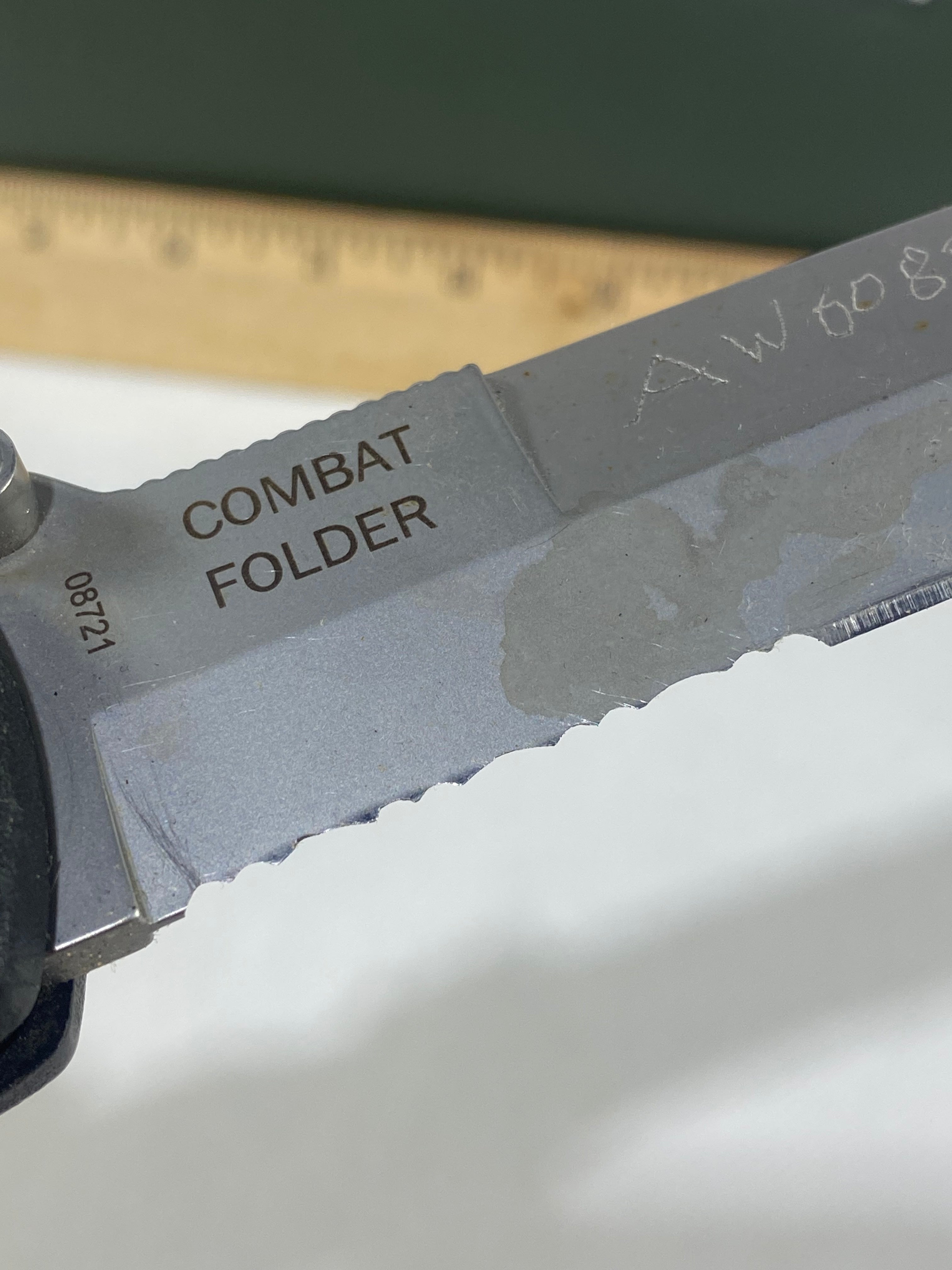 Gerber #-45. Applegate-Fairbairn Combat Folder. Light usage. Dirty. Blade has someone's name scratched on it.