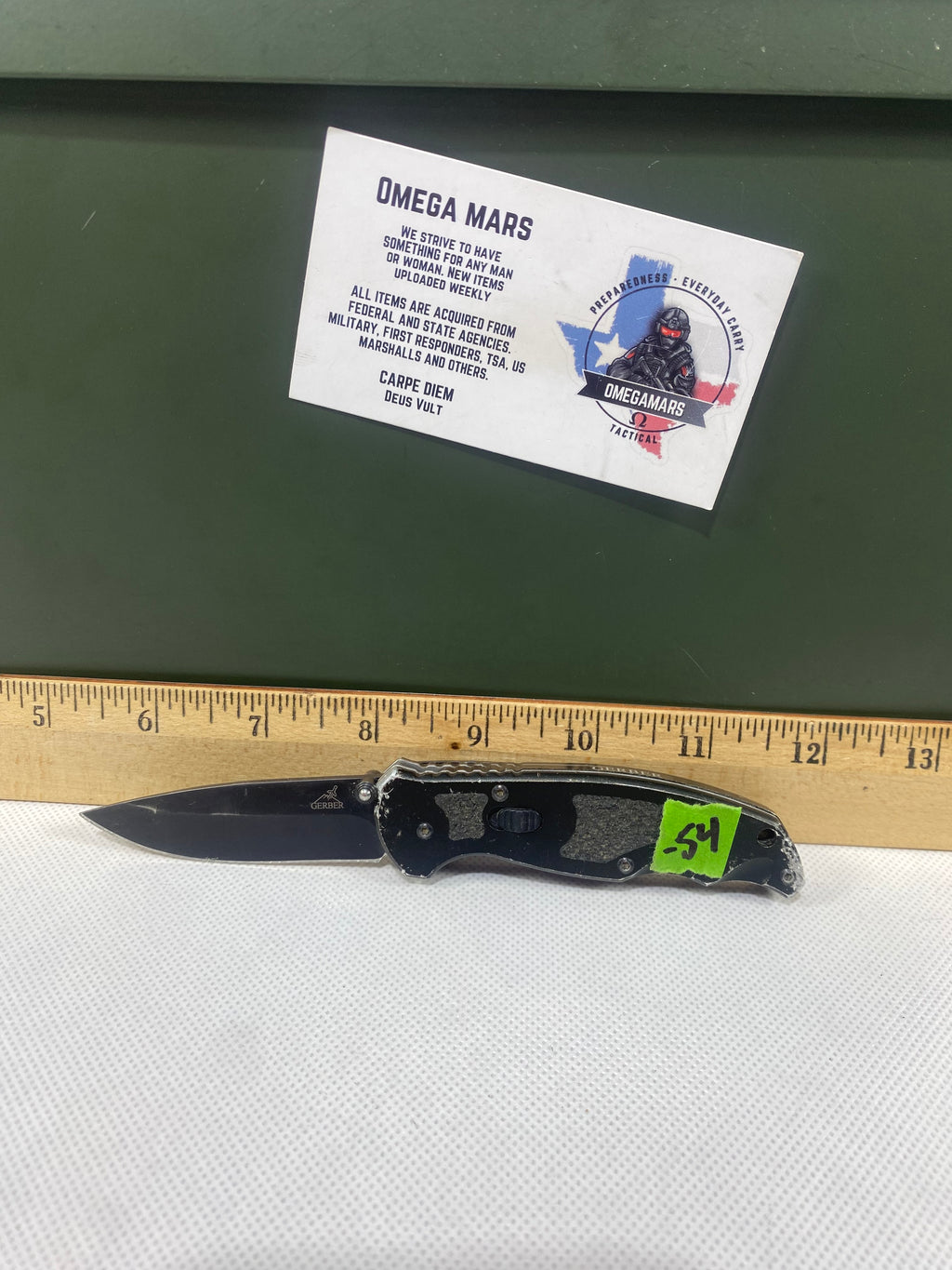 Gerber #-54. Answer F.A.S.T. Light usage. Dirty. Chip on blade. Handle bruised.