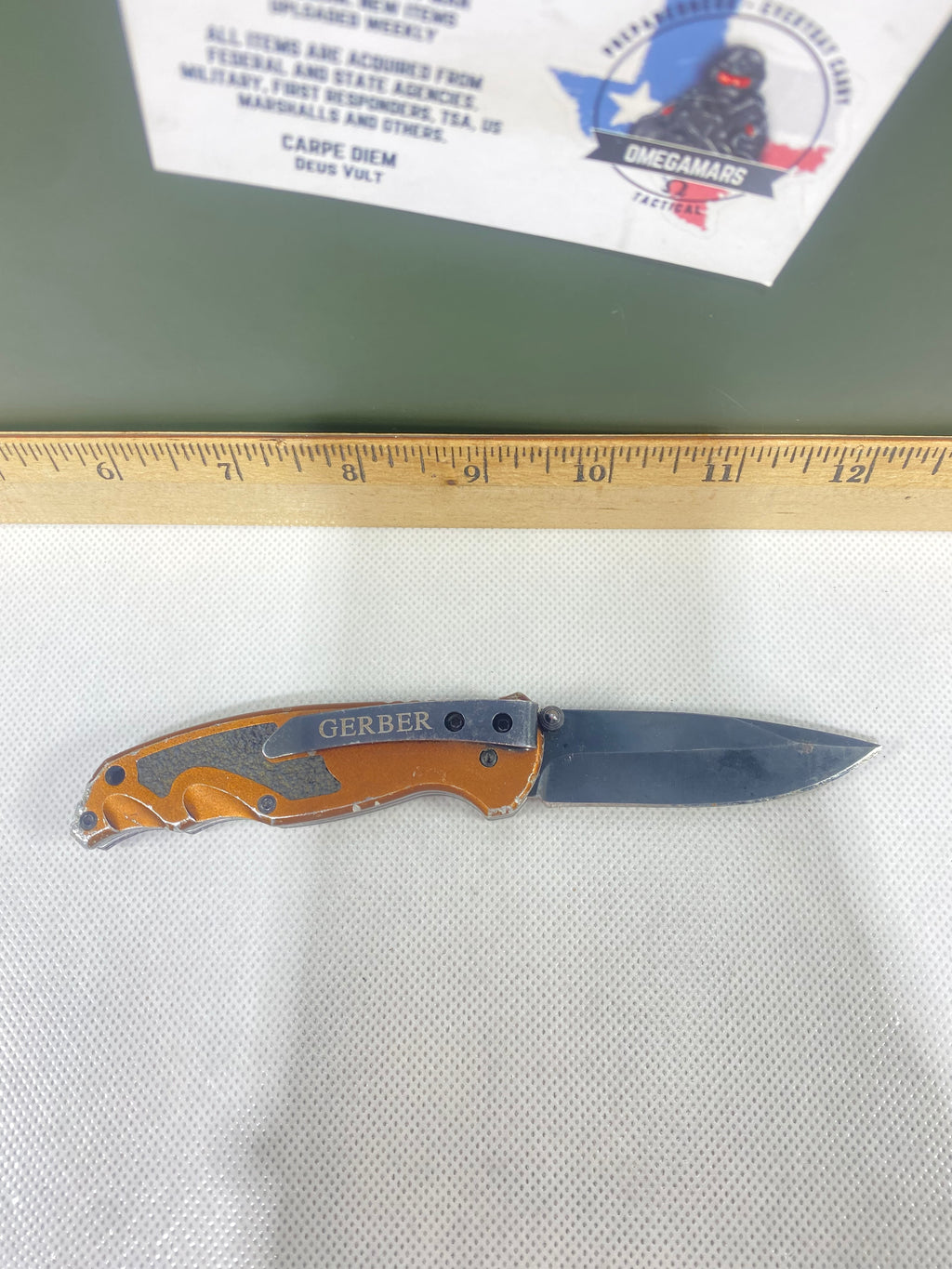Gerber #-54. Answer F.A.S.T. Light usage. Dirty. Chip on blade. Handle bruised.