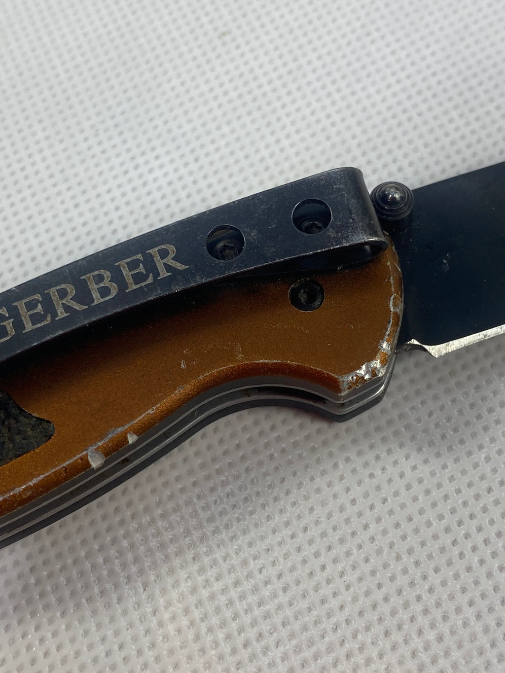 Gerber #-54. Answer F.A.S.T. Light usage. Dirty. Chip on blade. Handle bruised.