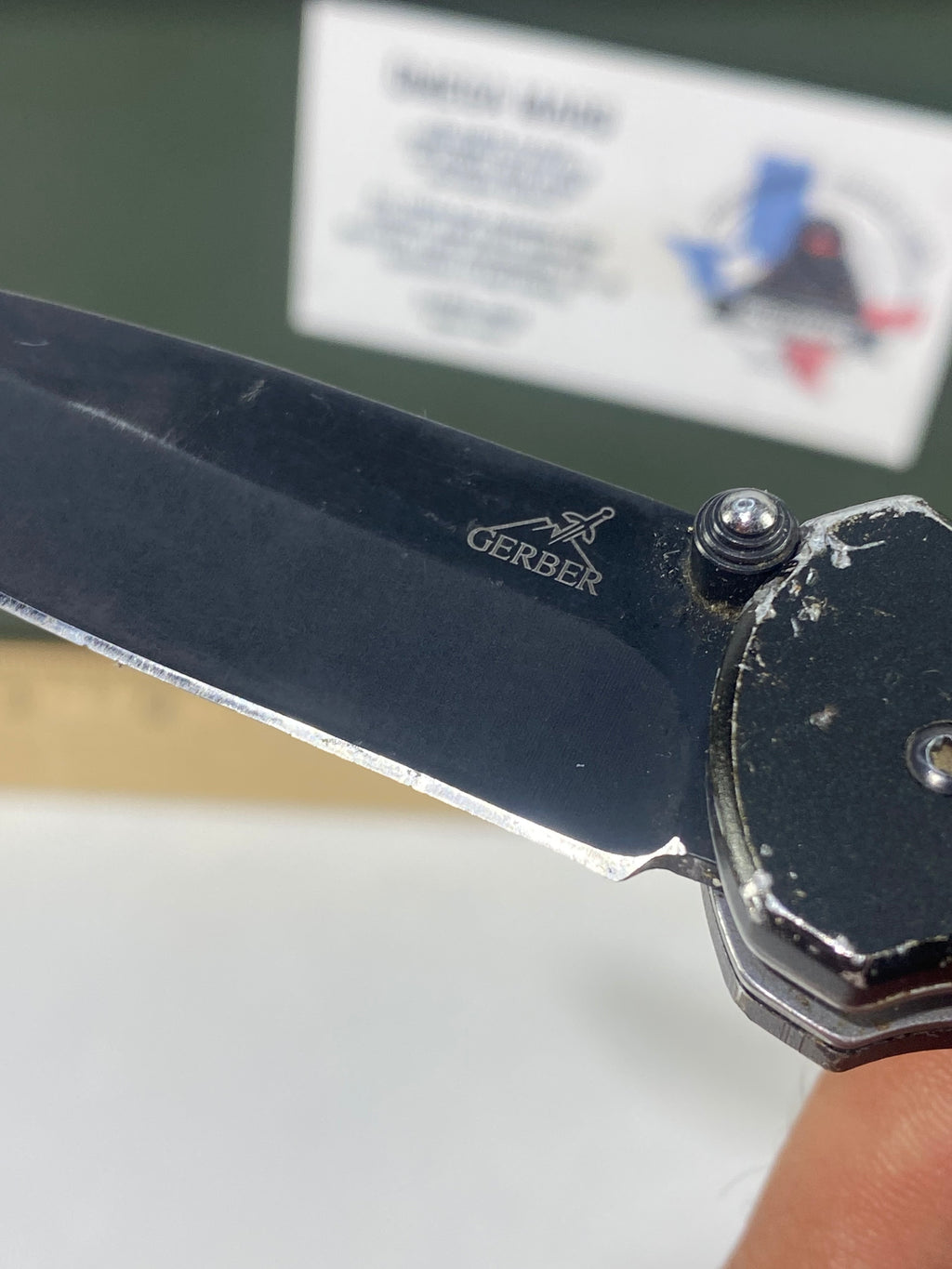 Gerber #-54. Answer F.A.S.T. Light usage. Dirty. Chip on blade. Handle bruised.
