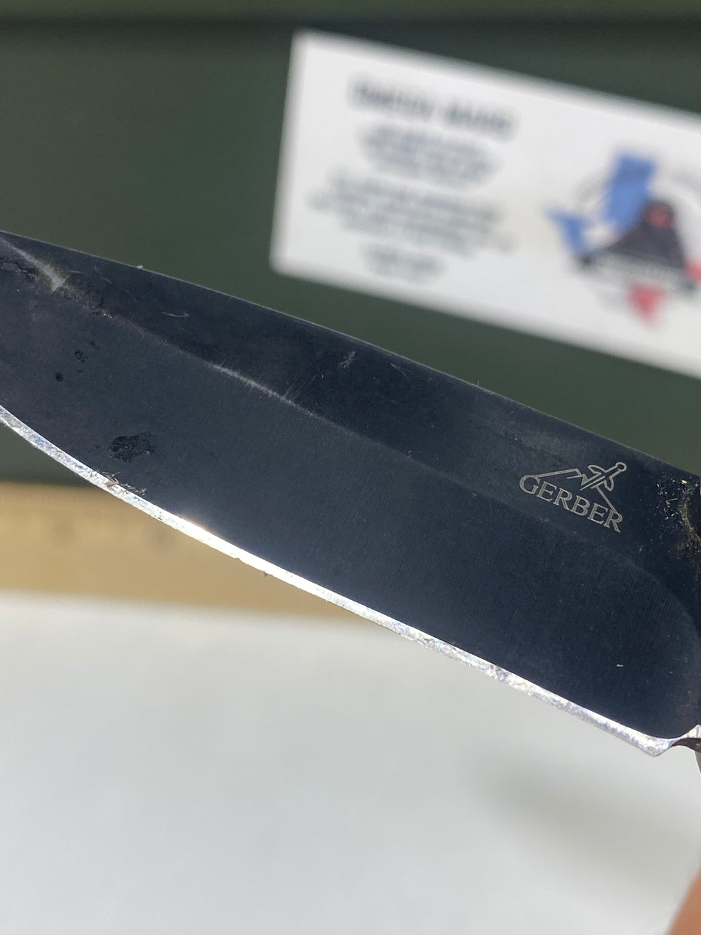 Gerber #-54. Answer F.A.S.T. Light usage. Dirty. Chip on blade. Handle bruised.
