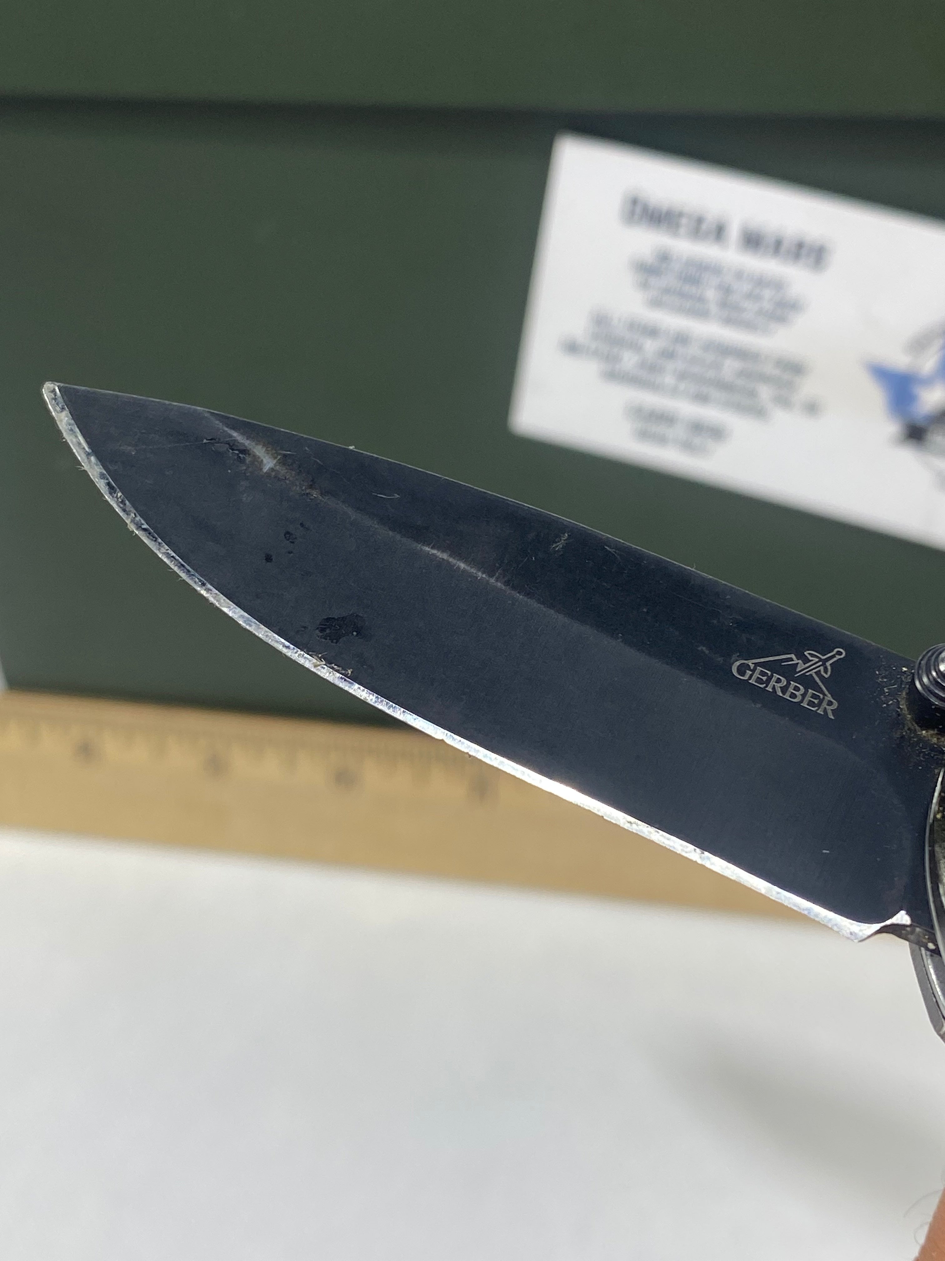 Gerber #-54. Answer F.A.S.T. Light usage. Dirty. Chip on blade. Handle bruised.
