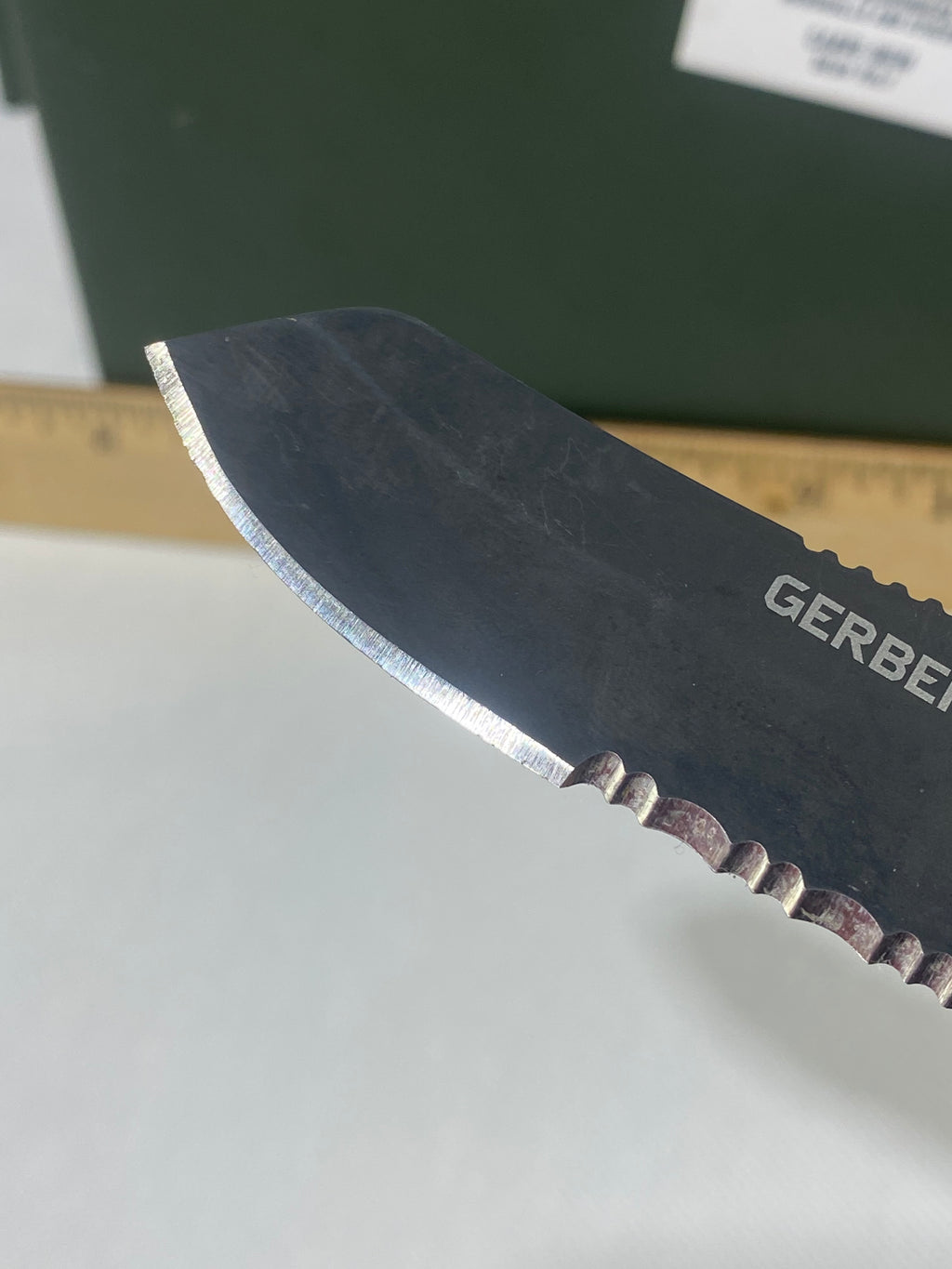 Gerber #-61. E-Z Out DPSF. Light usage. Dings on blade.