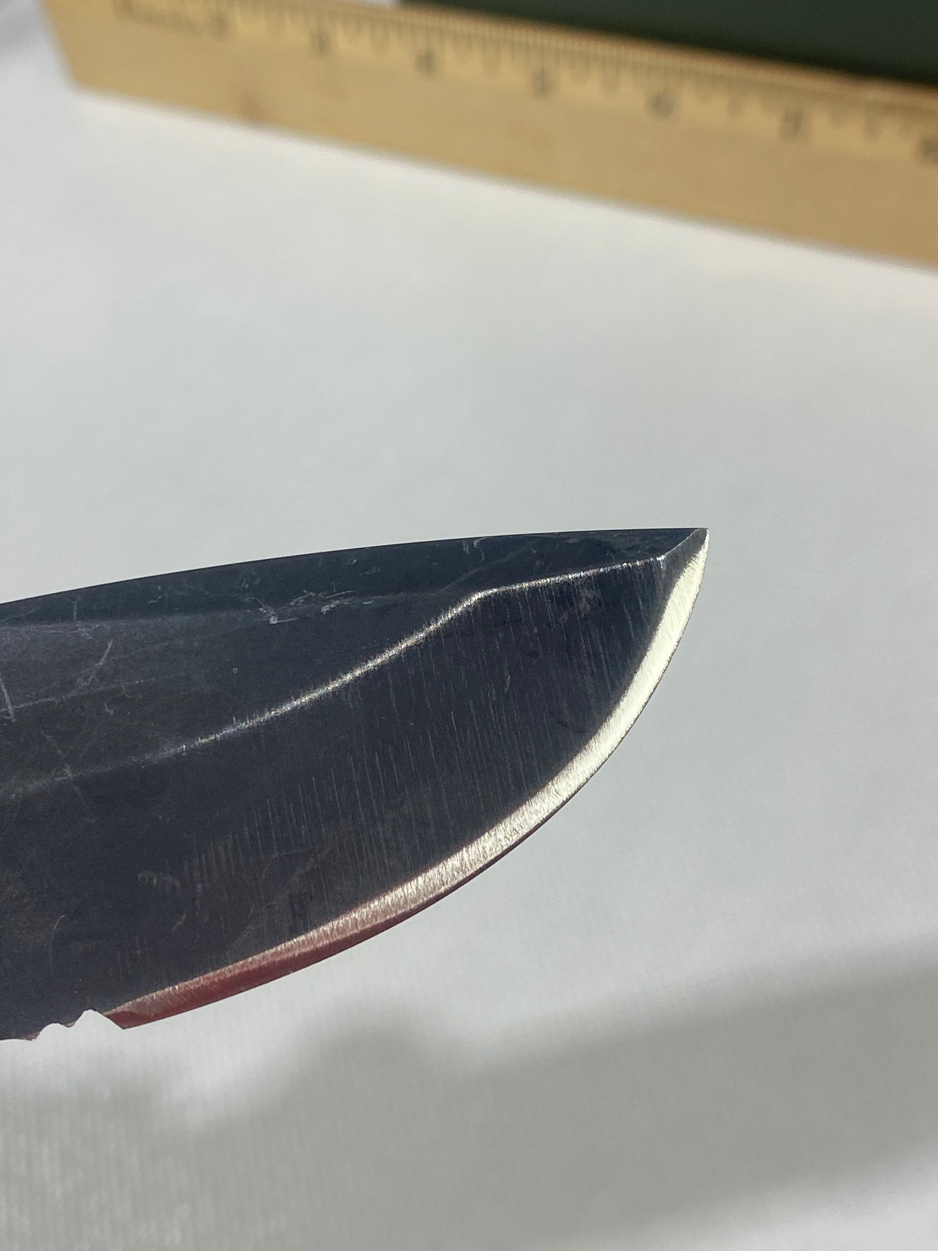 Gerber -77. Light usage. Resharpened.