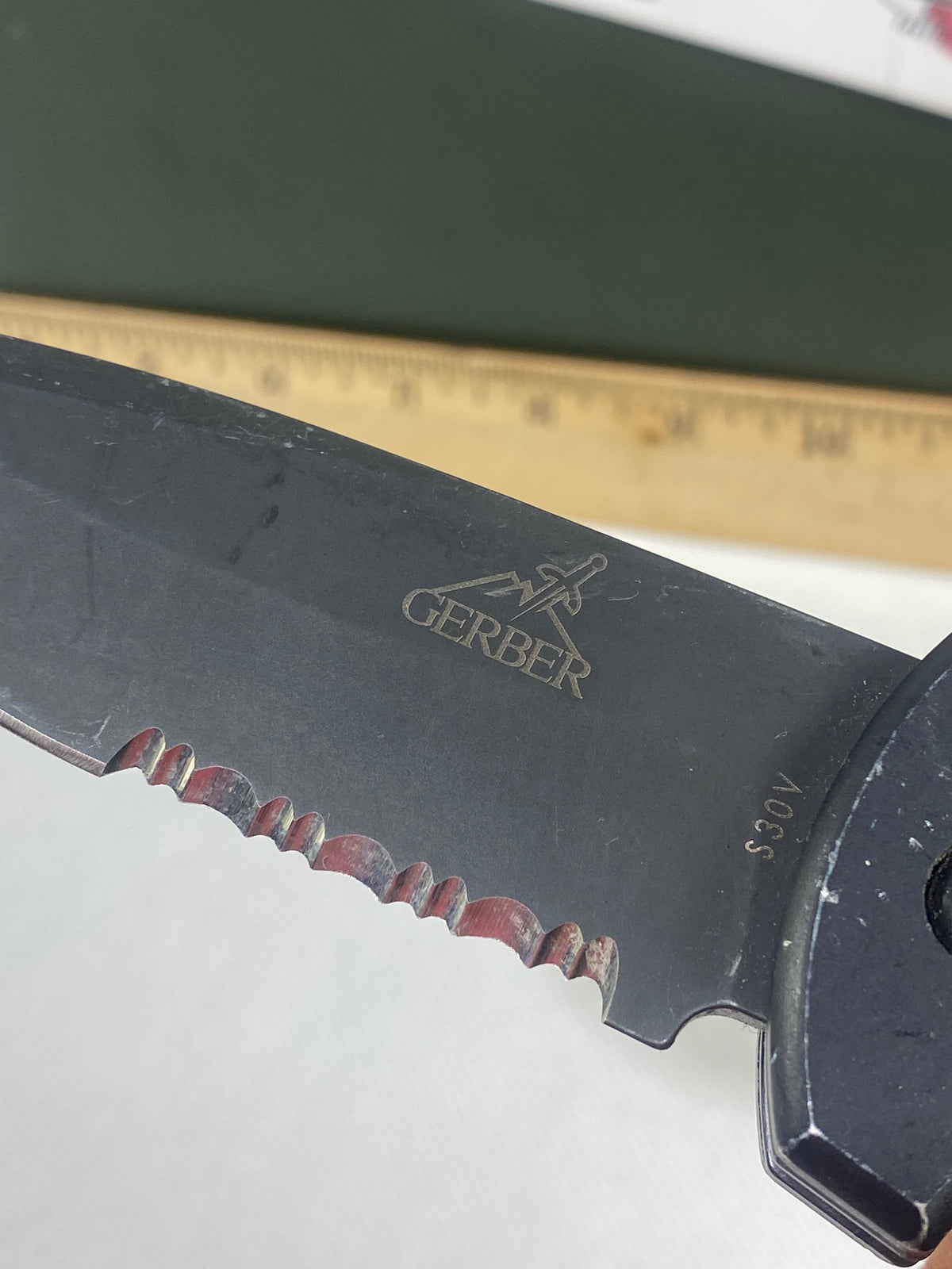 Gerber -77. Light usage. Resharpened.