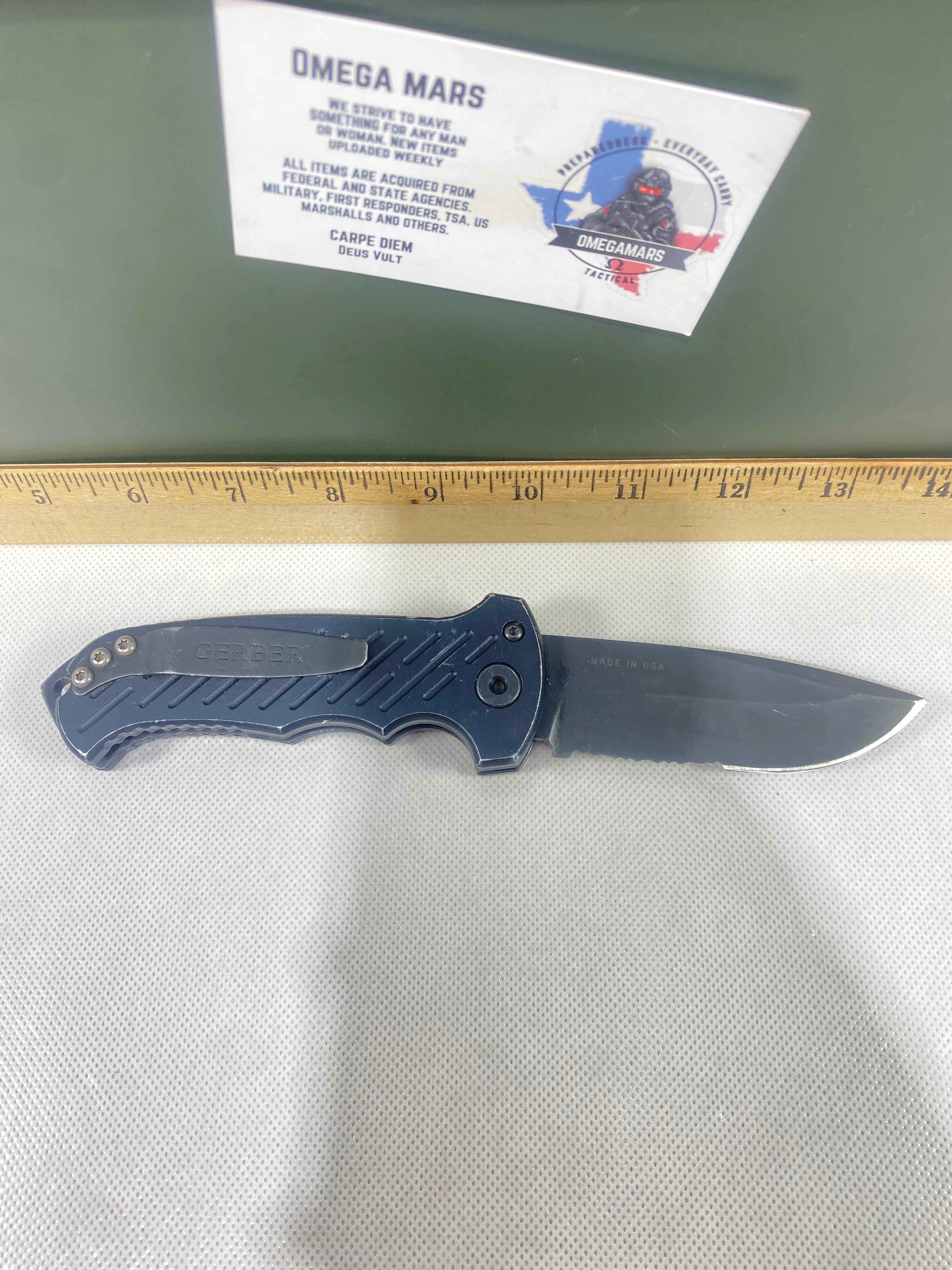 Gerber -80. 06. Light usage. Resharpened. Ding on blade.
