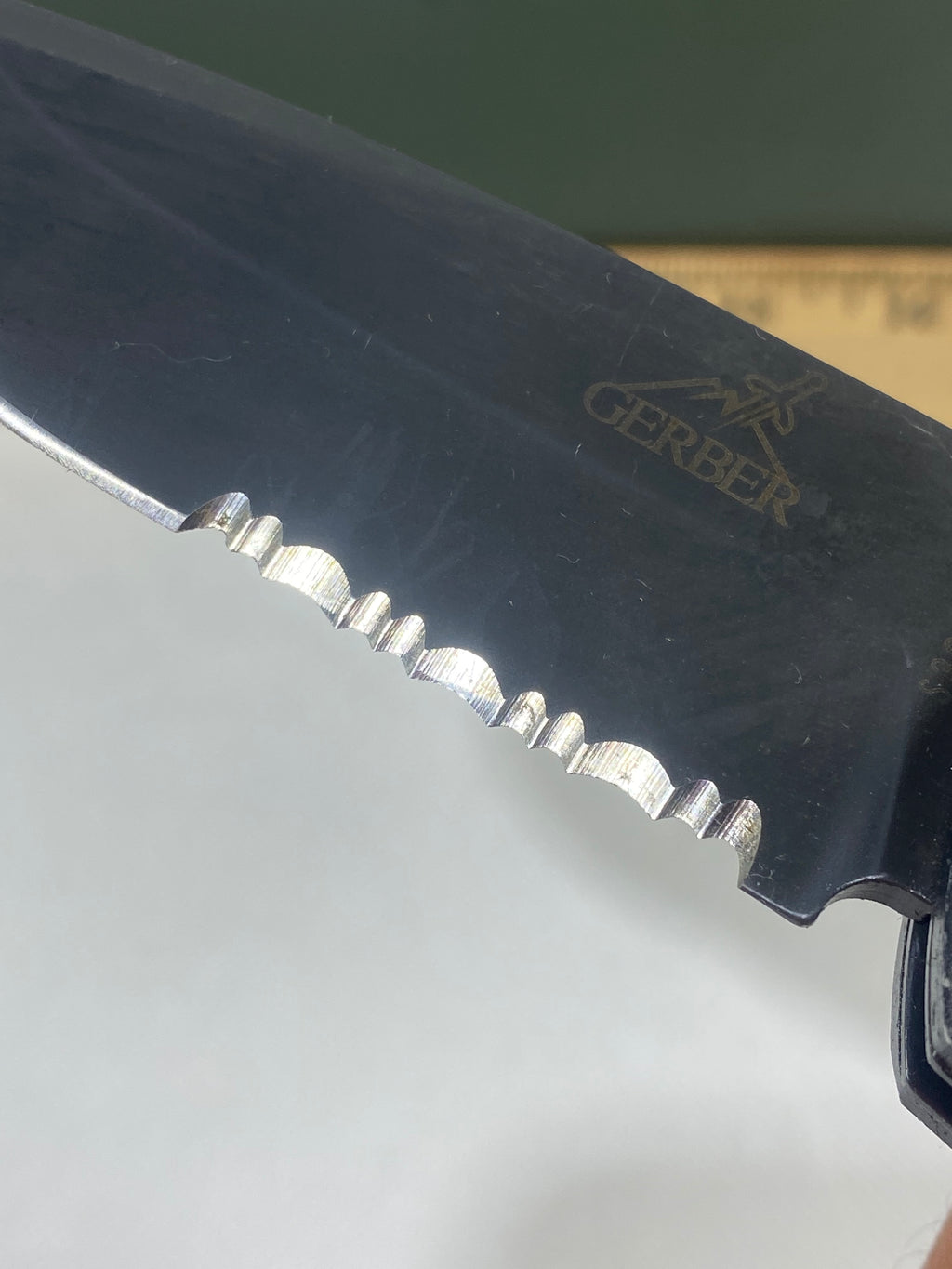 Gerber -80. 06. Light usage. Resharpened. Ding on blade.