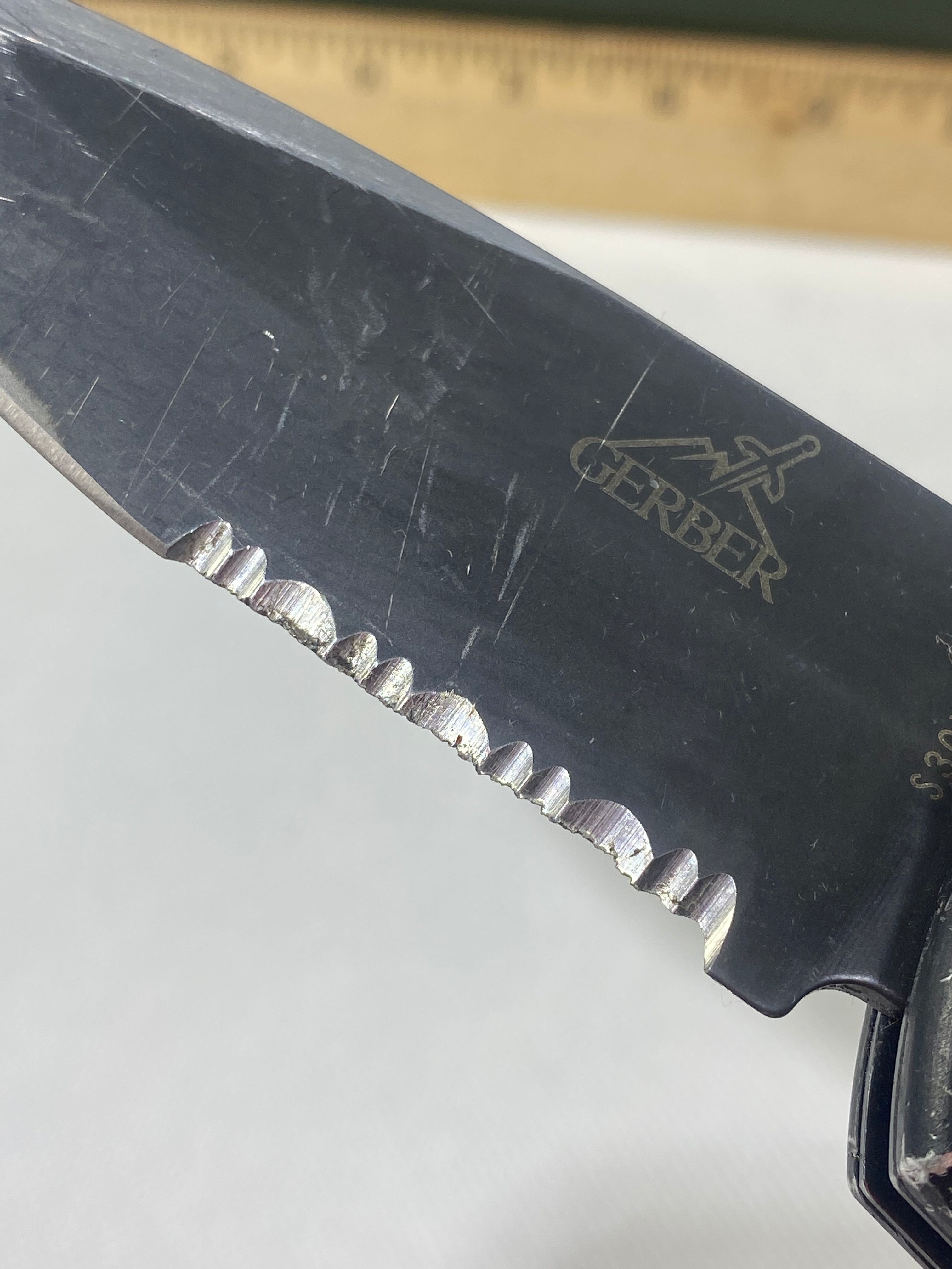 Gerber -85. 06. Light usage. Resharpened. A name is scratched into the blade. Needs Oil.