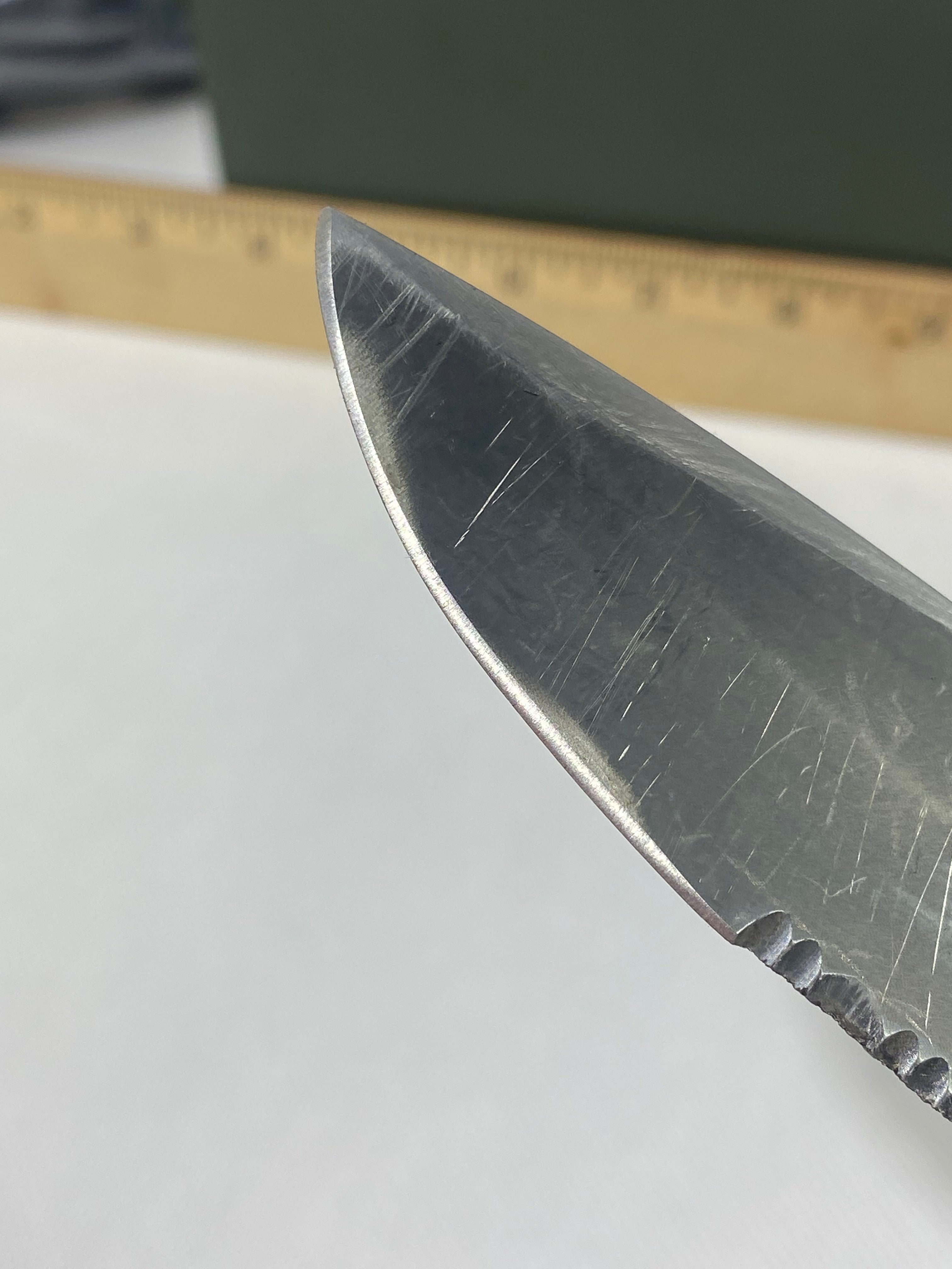 Gerber -85. 06. Light usage. Resharpened. A name is scratched into the blade. Needs Oil.