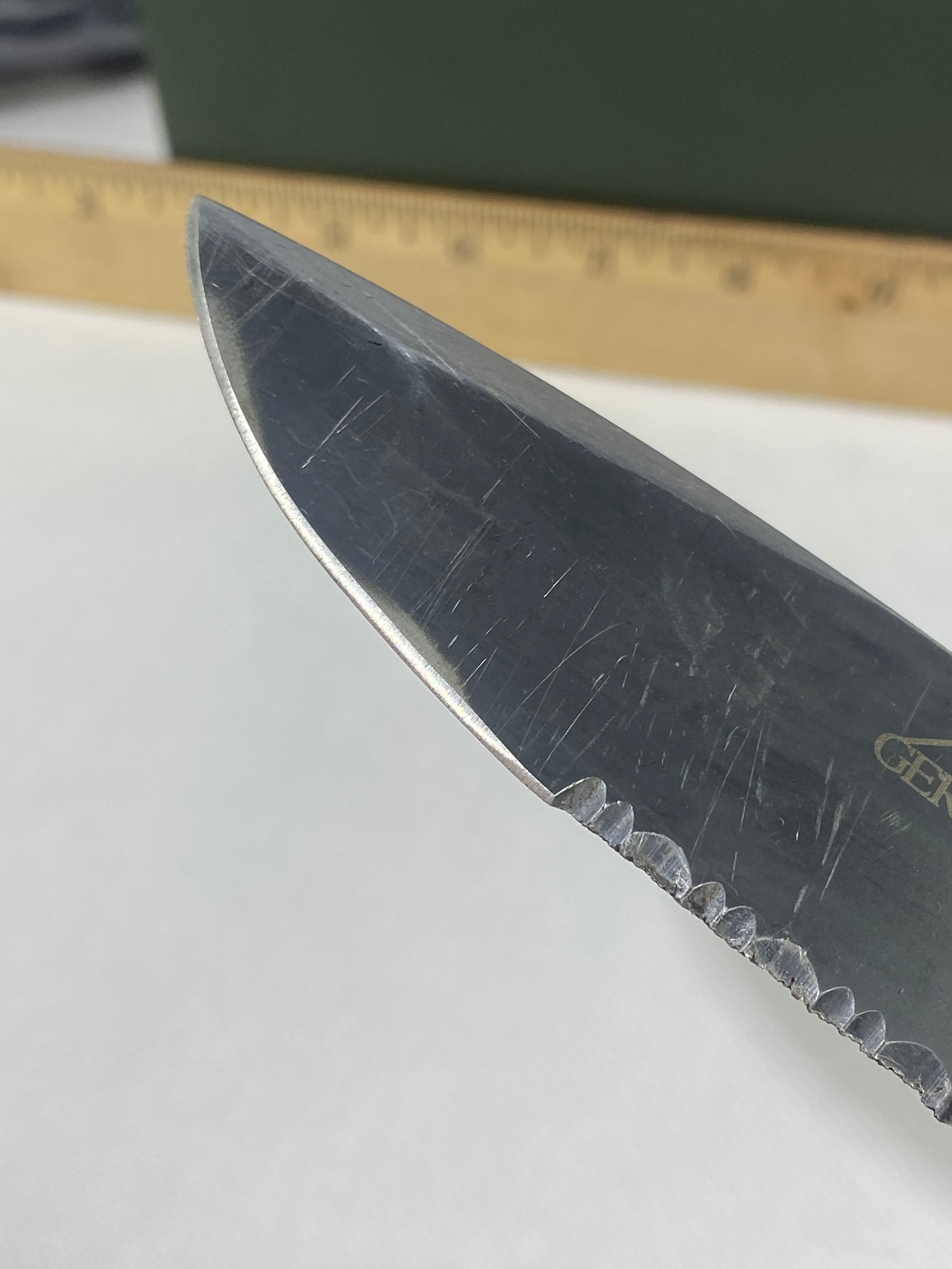 Gerber -85. 06. Light usage. Resharpened. A name is scratched into the blade. Needs Oil.