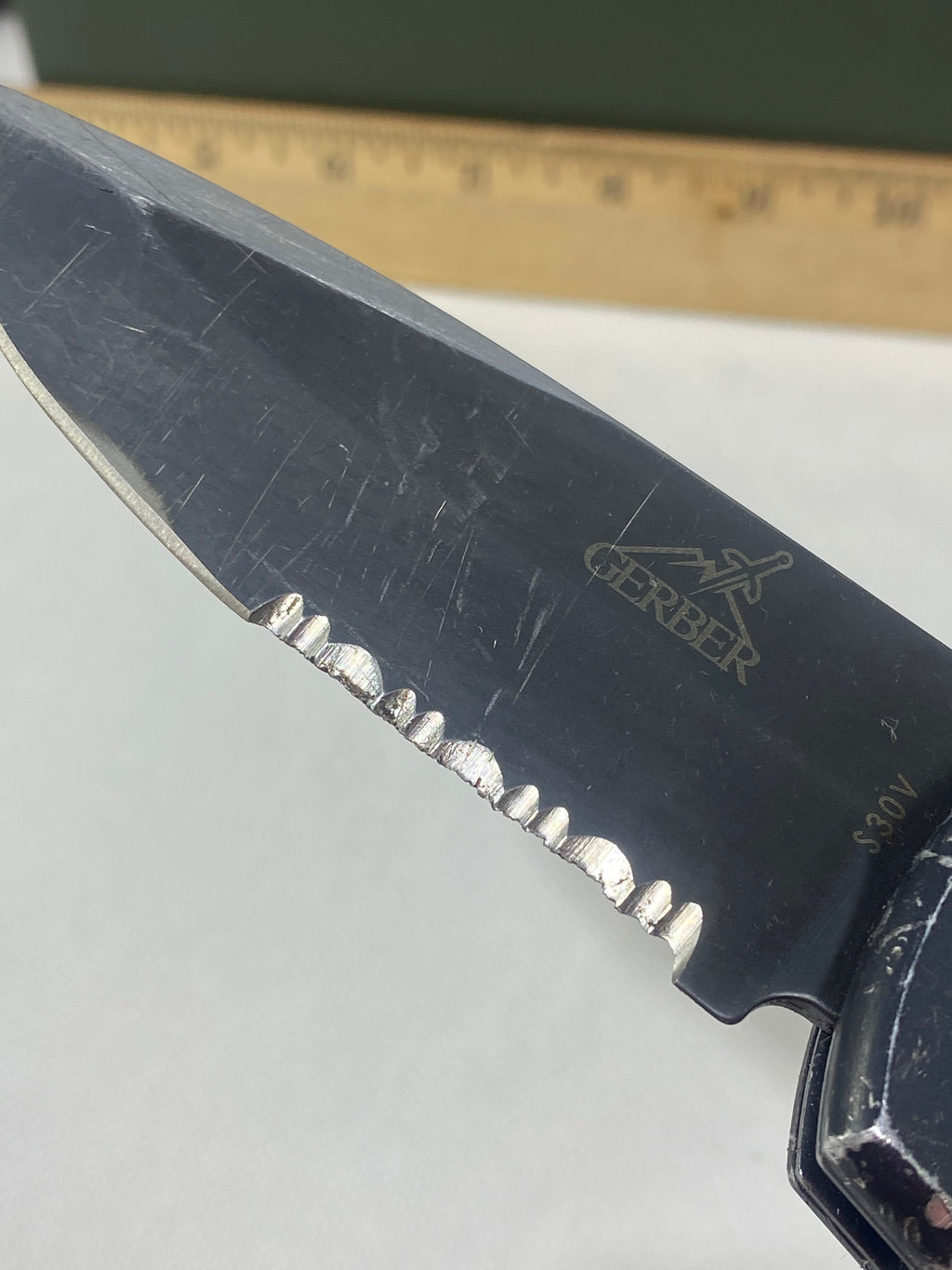 Gerber -85. 06. Light usage. Resharpened. A name is scratched into the blade. Needs Oil.