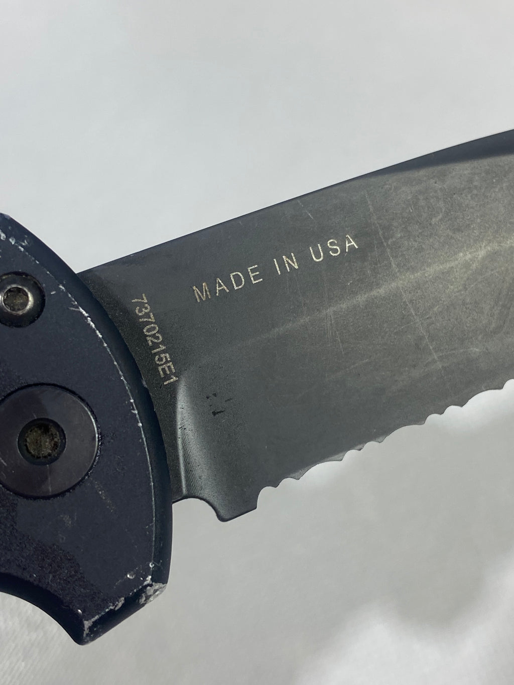 Gerber -86. 06. Light usage. Dings on blade. A name is scratched on the blade.