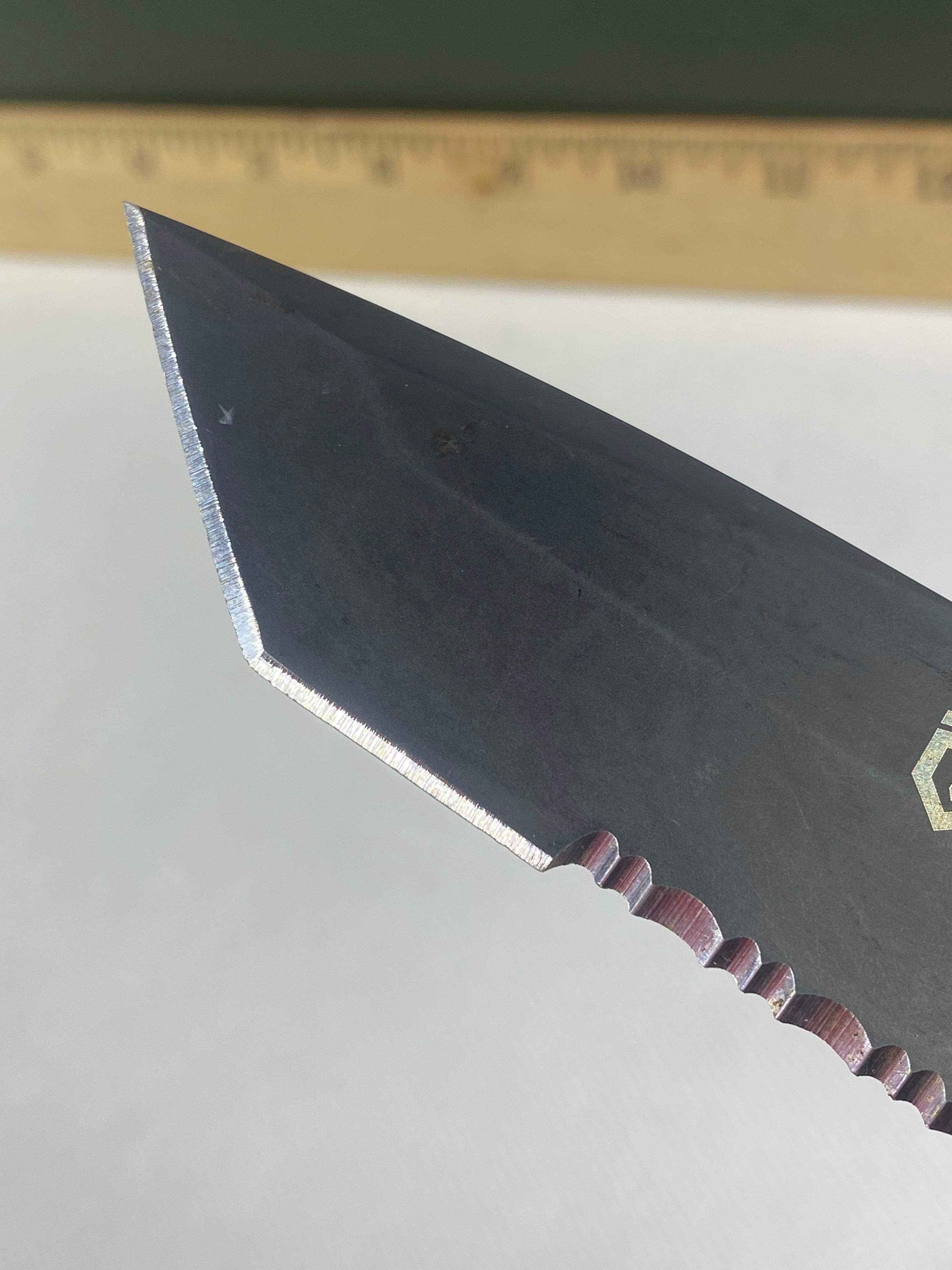 Gerber -86. 06. Light usage. Dings on blade. A name is scratched on the blade.