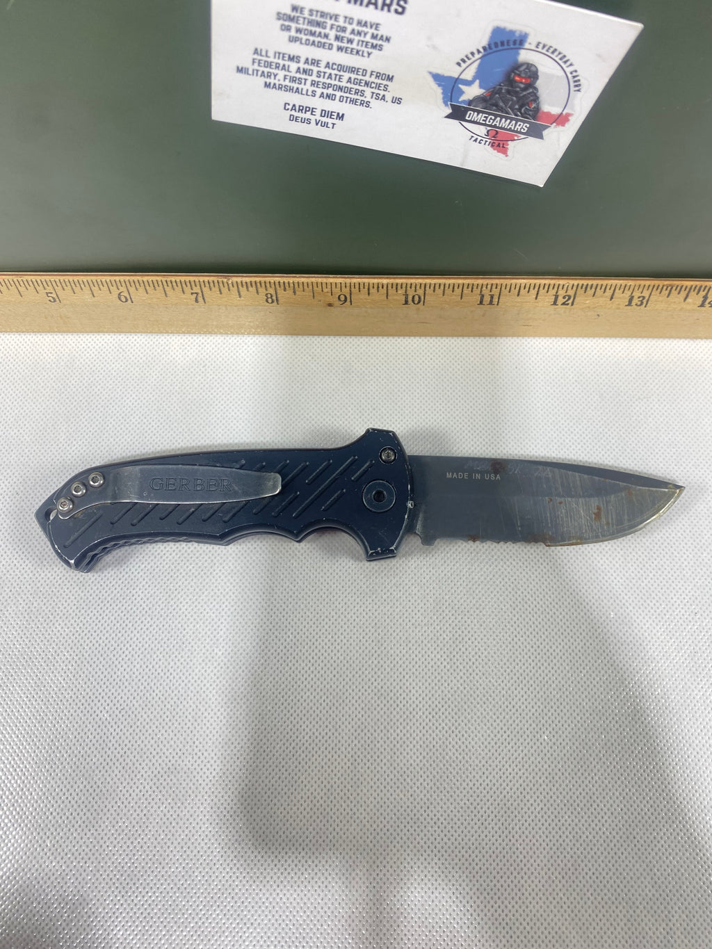 Gerber -89. 06. Light usage. Resharpened. Possible rust. Handle scratched. Dirty.