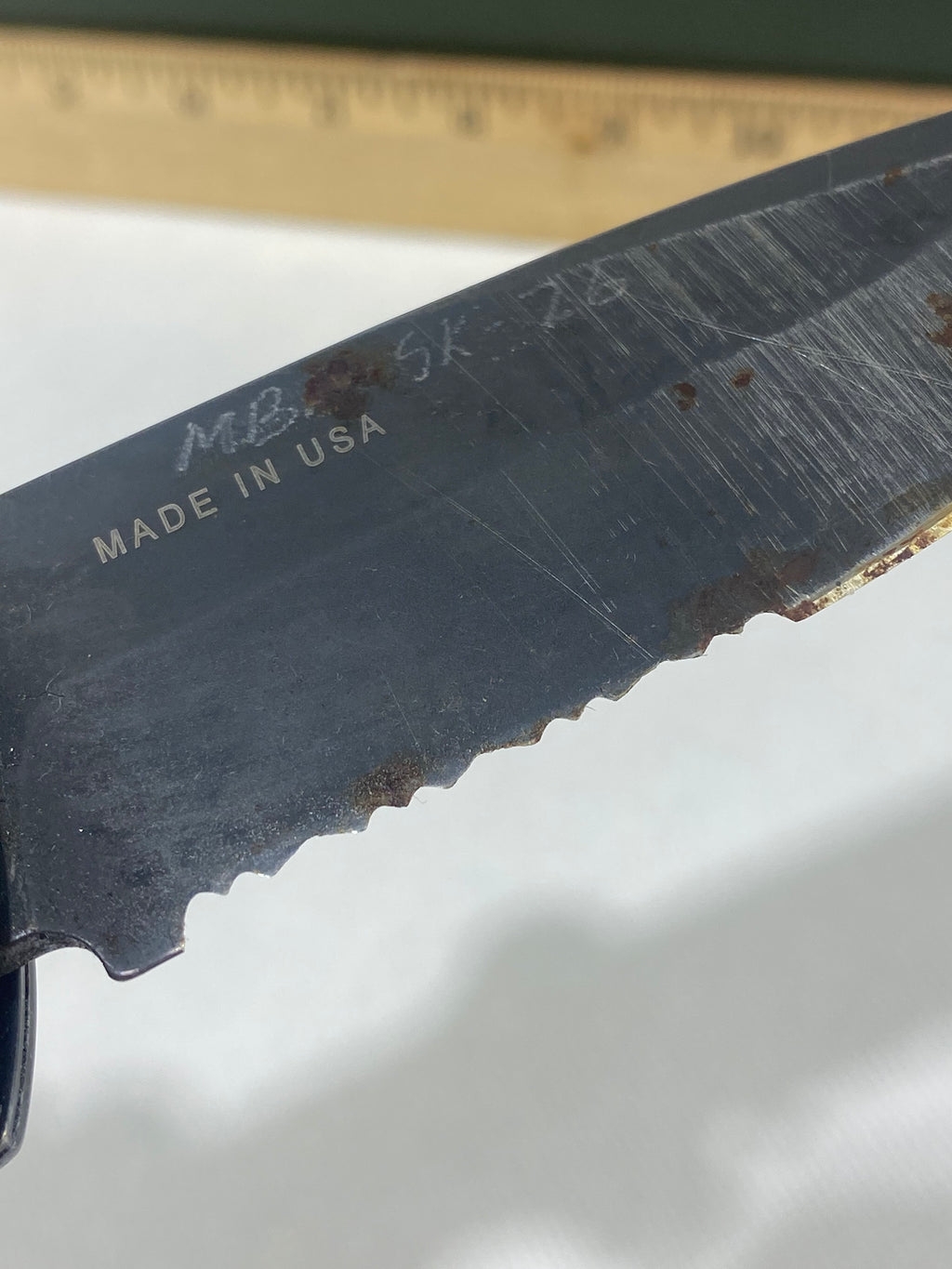 Gerber -89. 06. Light usage. Resharpened. Possible rust. Handle scratched. Dirty.