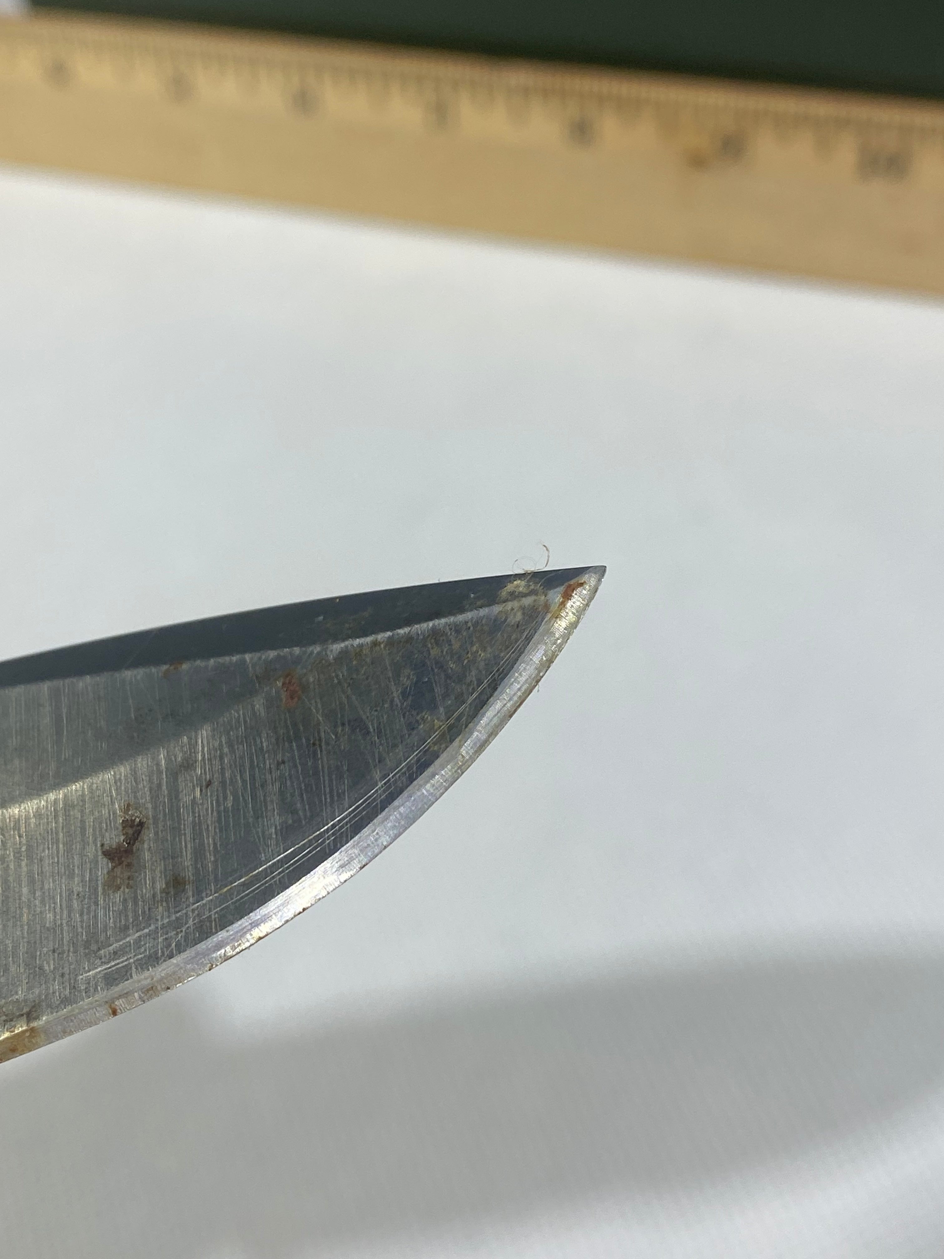 Gerber -89. 06. Light usage. Resharpened. Possible rust. Handle scratched. Dirty.