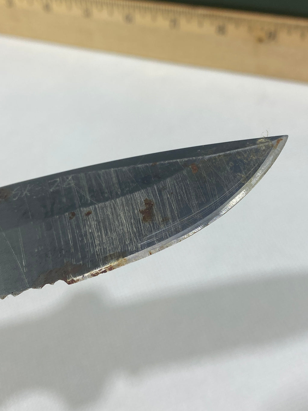 Gerber -89. 06. Light usage. Resharpened. Possible rust. Handle scratched. Dirty.