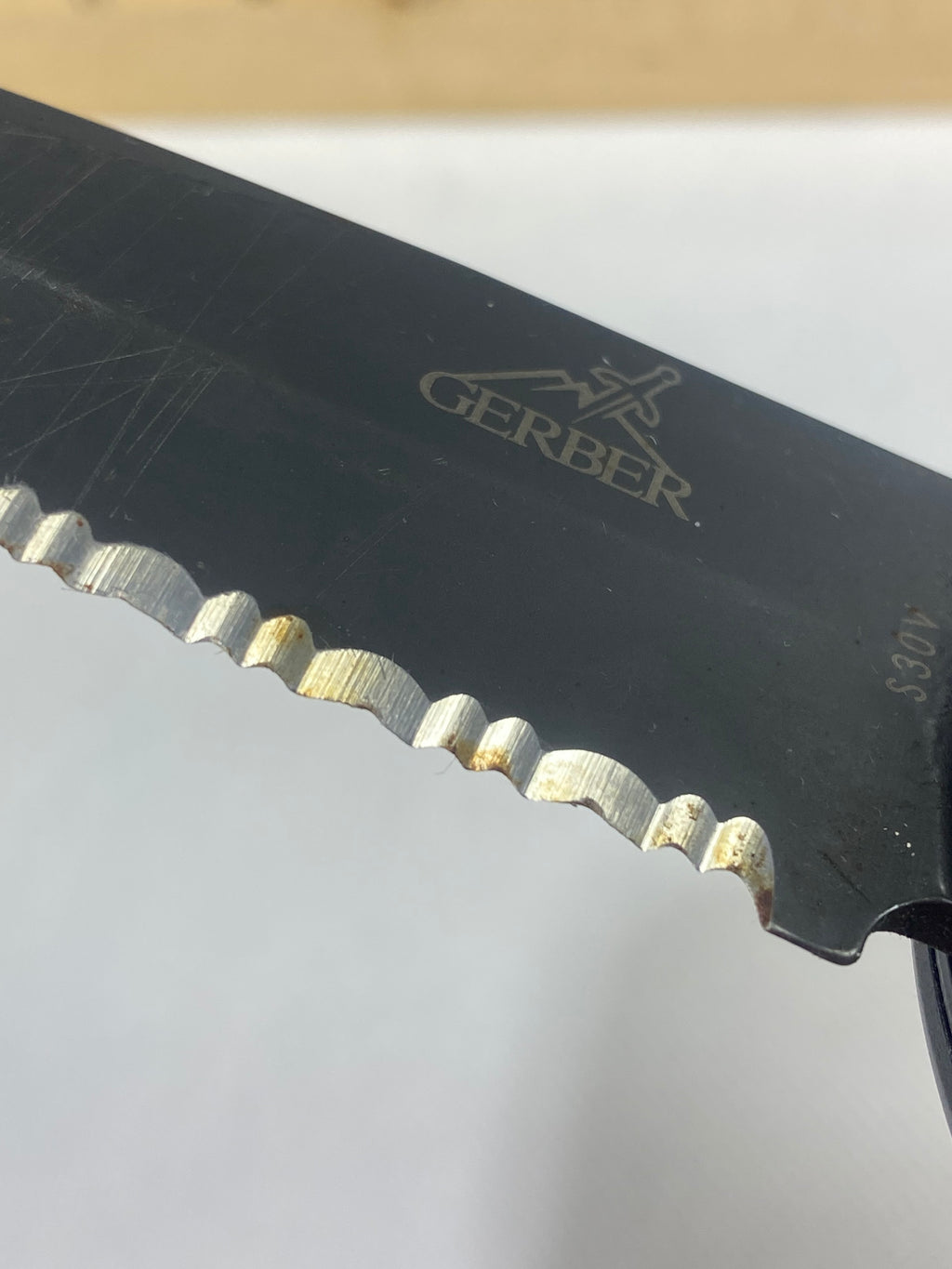 Gerber -89. 06. Light usage. Resharpened. Possible rust. Handle scratched. Dirty.