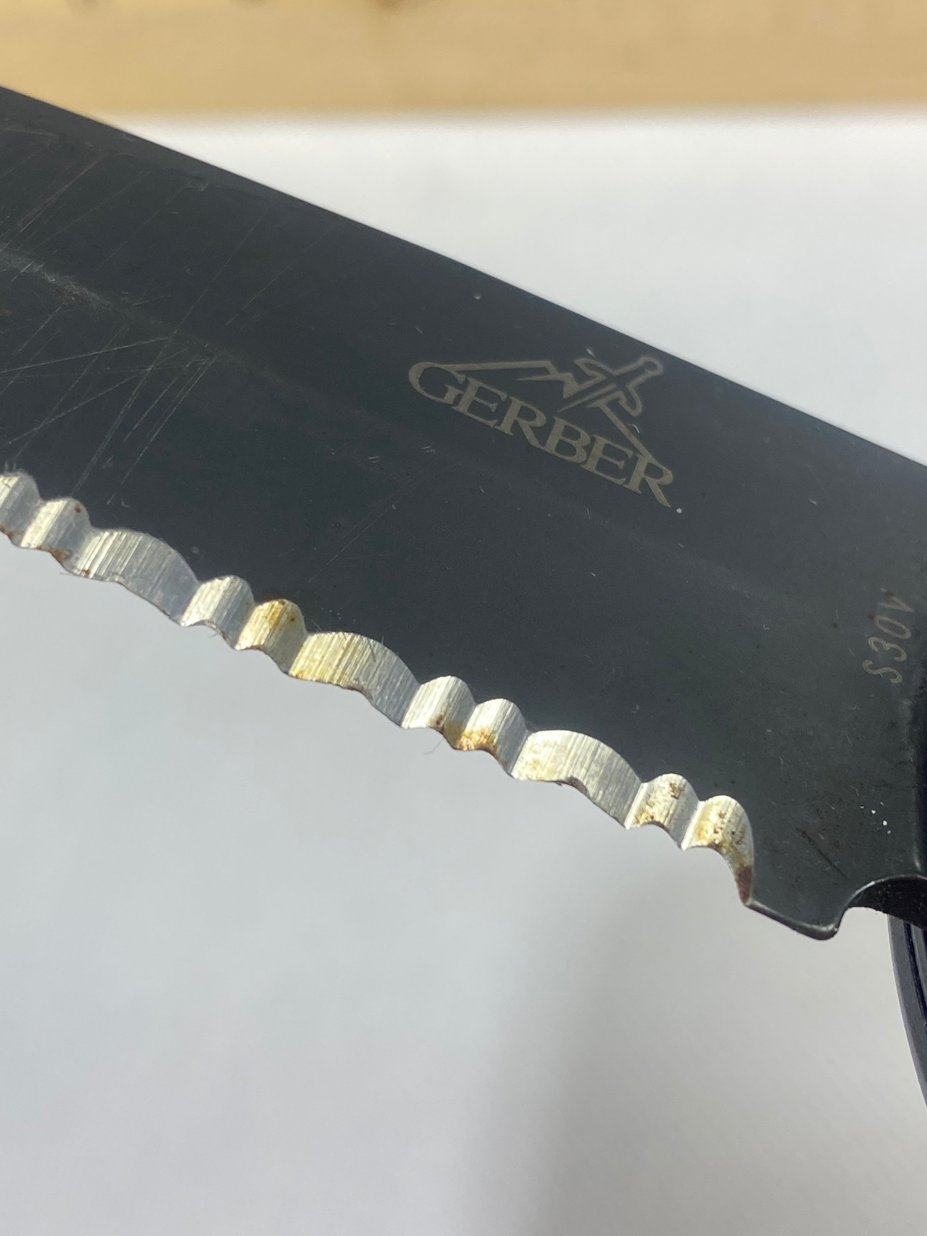 Gerber -89. 06. Light usage. Resharpened. Possible rust. Handle scratched. Dirty.