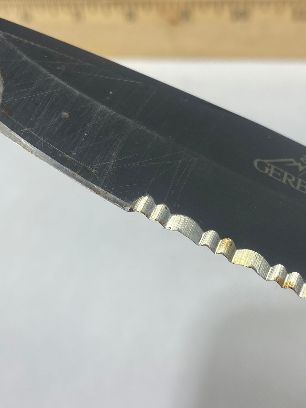 Gerber -89. 06. Light usage. Resharpened. Possible rust. Handle scratched. Dirty.
