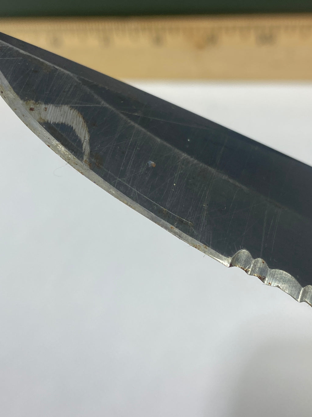 Gerber -89. 06. Light usage. Resharpened. Possible rust. Handle scratched. Dirty.
