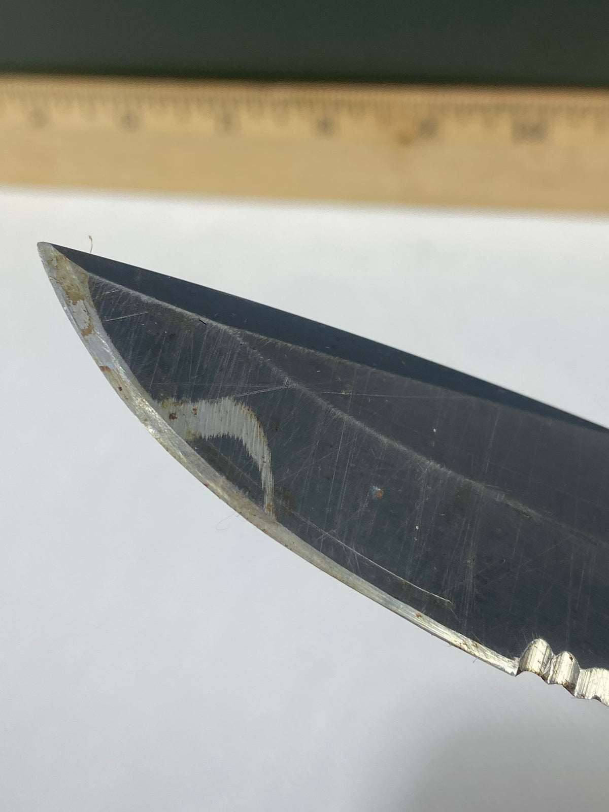 Gerber -89. 06. Light usage. Resharpened. Possible rust. Handle scratched. Dirty.