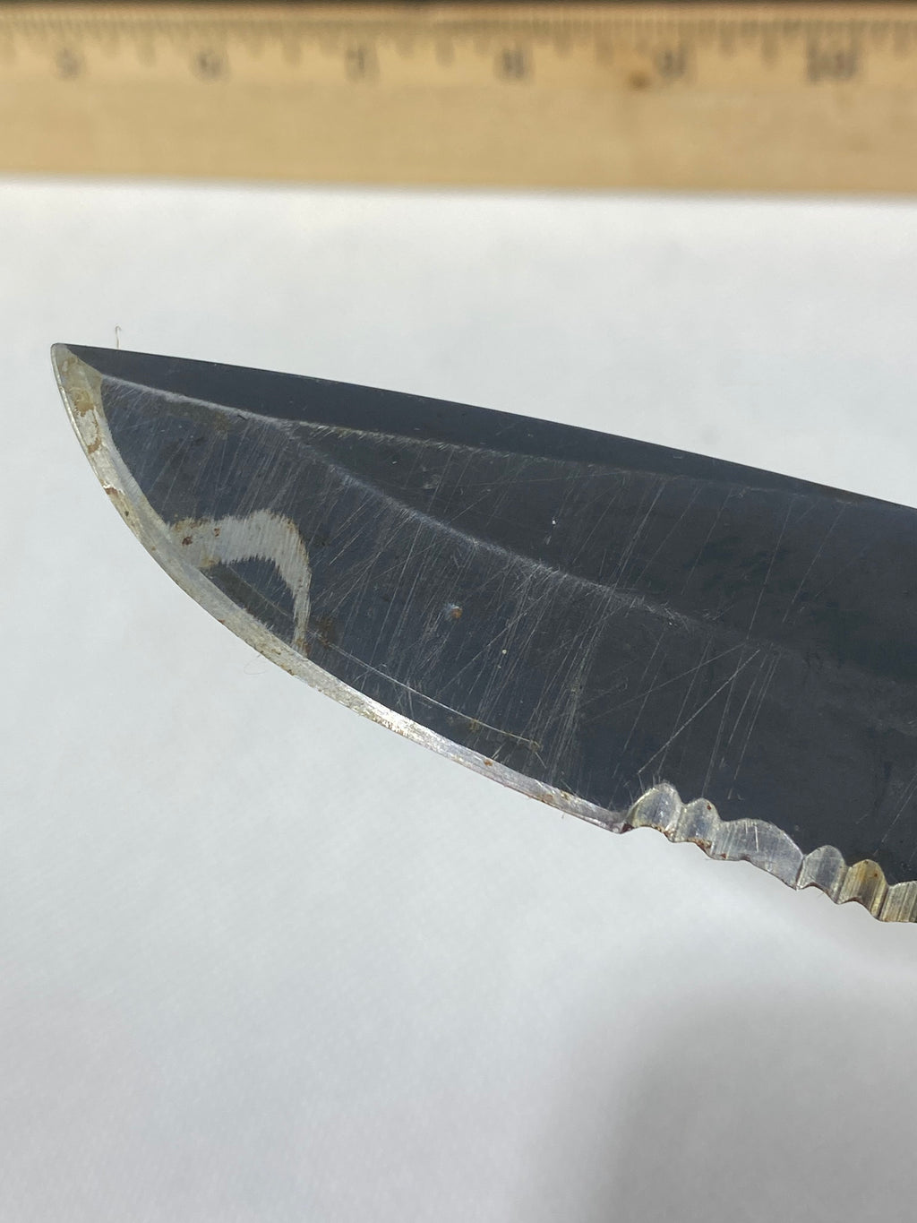 Gerber -89. 06. Light usage. Resharpened. Possible rust. Handle scratched. Dirty.