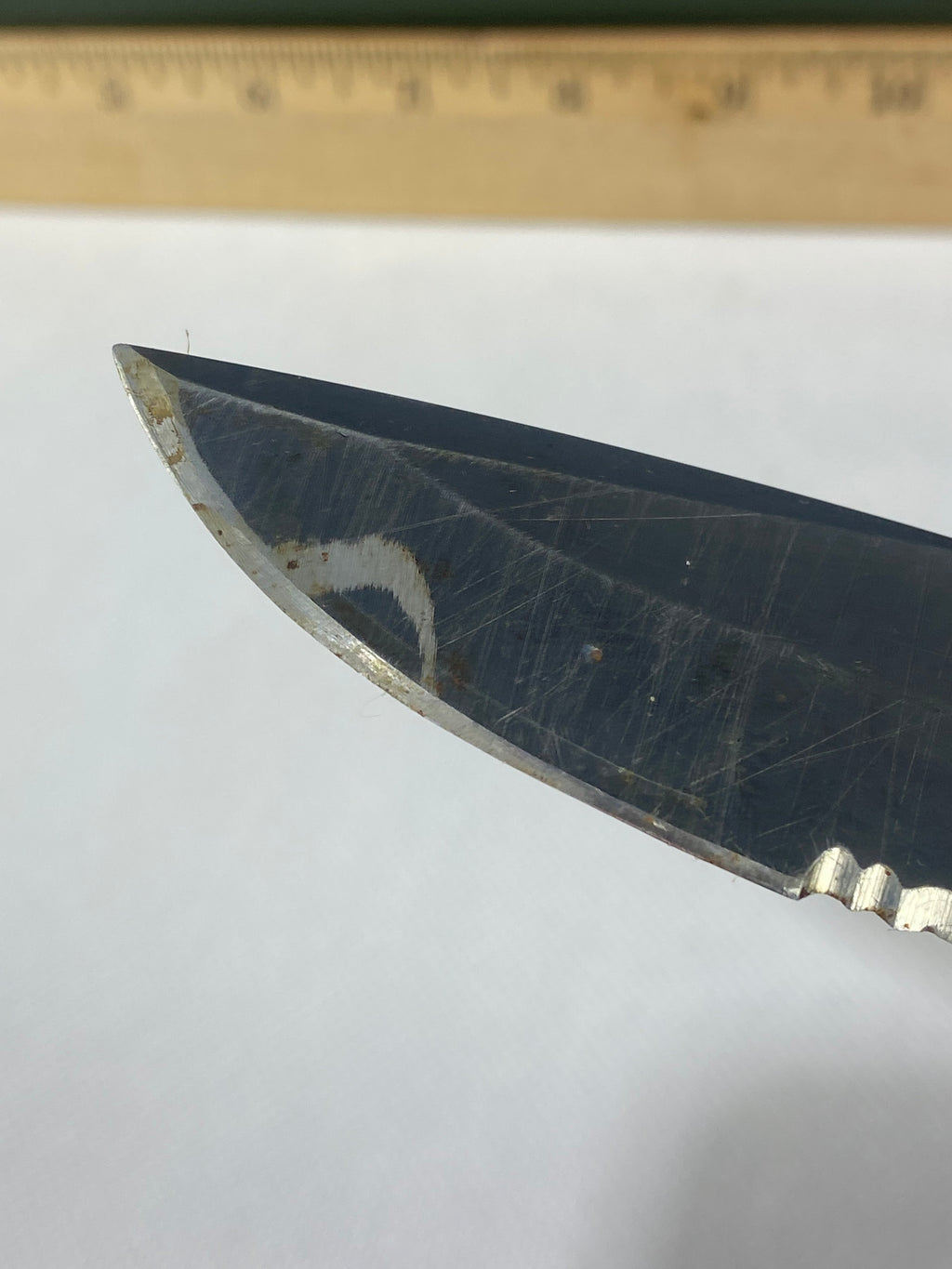 Gerber -89. 06. Light usage. Resharpened. Possible rust. Handle scratched. Dirty.