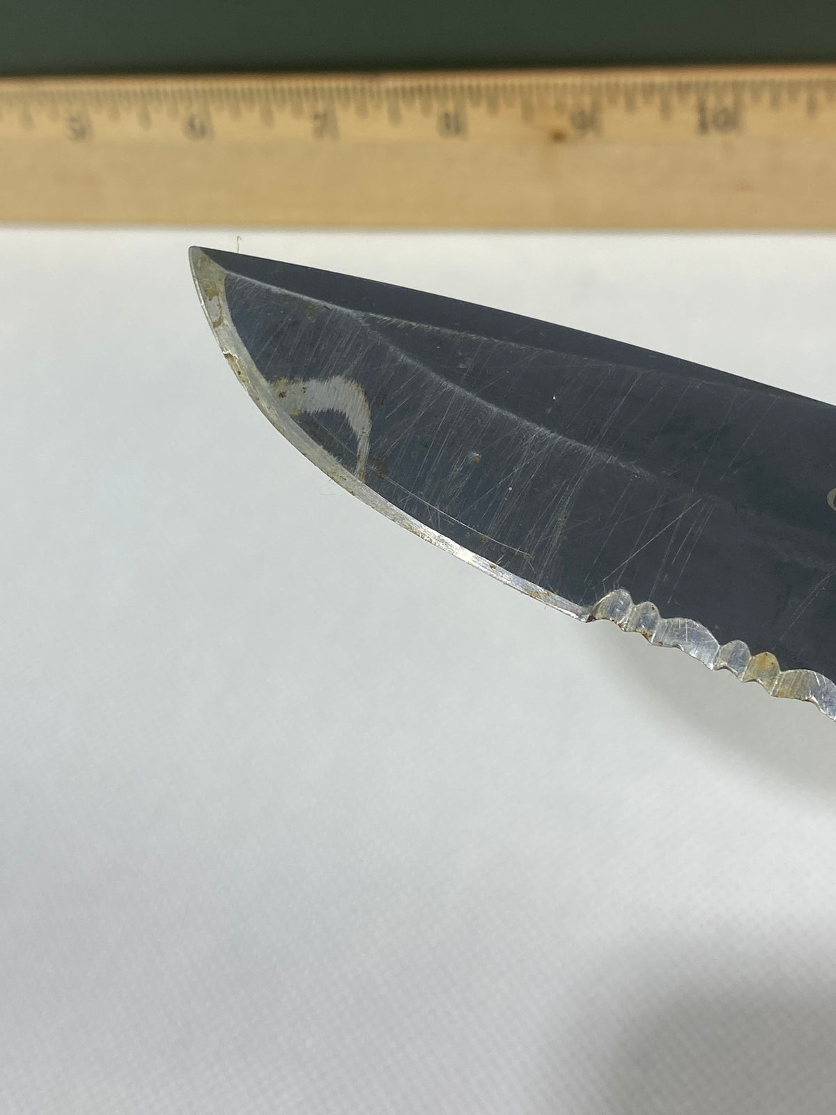 Gerber -89. 06. Light usage. Resharpened. Possible rust. Handle scratched. Dirty.