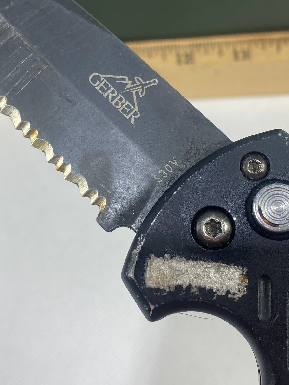 Gerber -89. 06. Light usage. Resharpened. Possible rust. Handle scratched. Dirty.