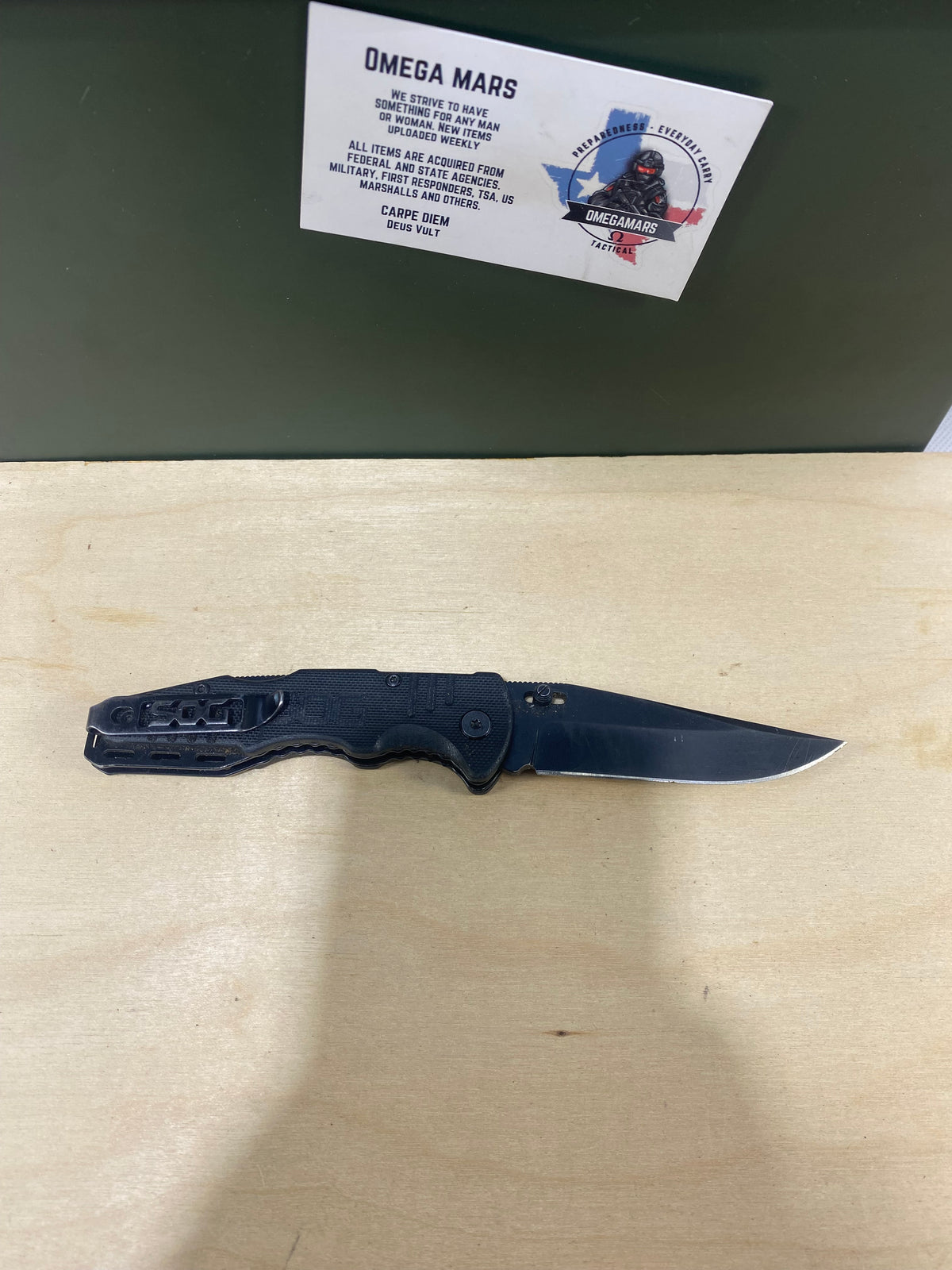 SOG Salute Mini #SG12.  Light Usage. Little dirty. Resharpened.
