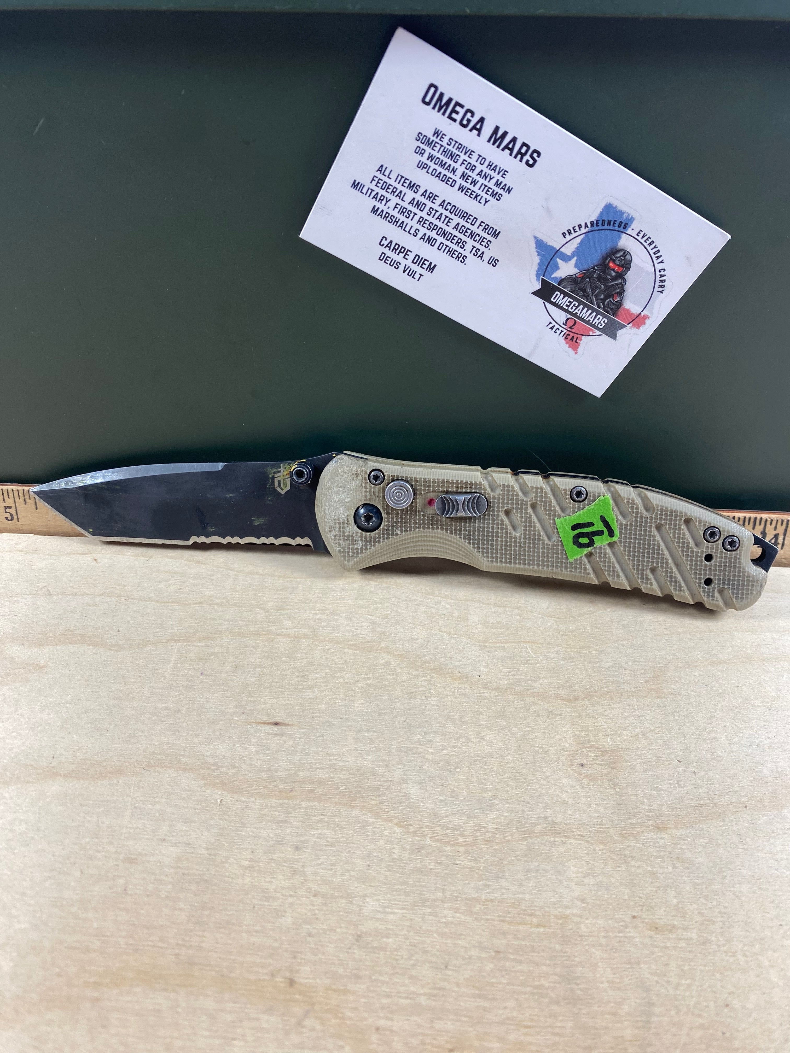 Gerber #91 Propel Downrange AO Knife Desert Tan Assisted Opening. Light usage. Dirty. Chip on blade. (MSRP $198.00 NEW)